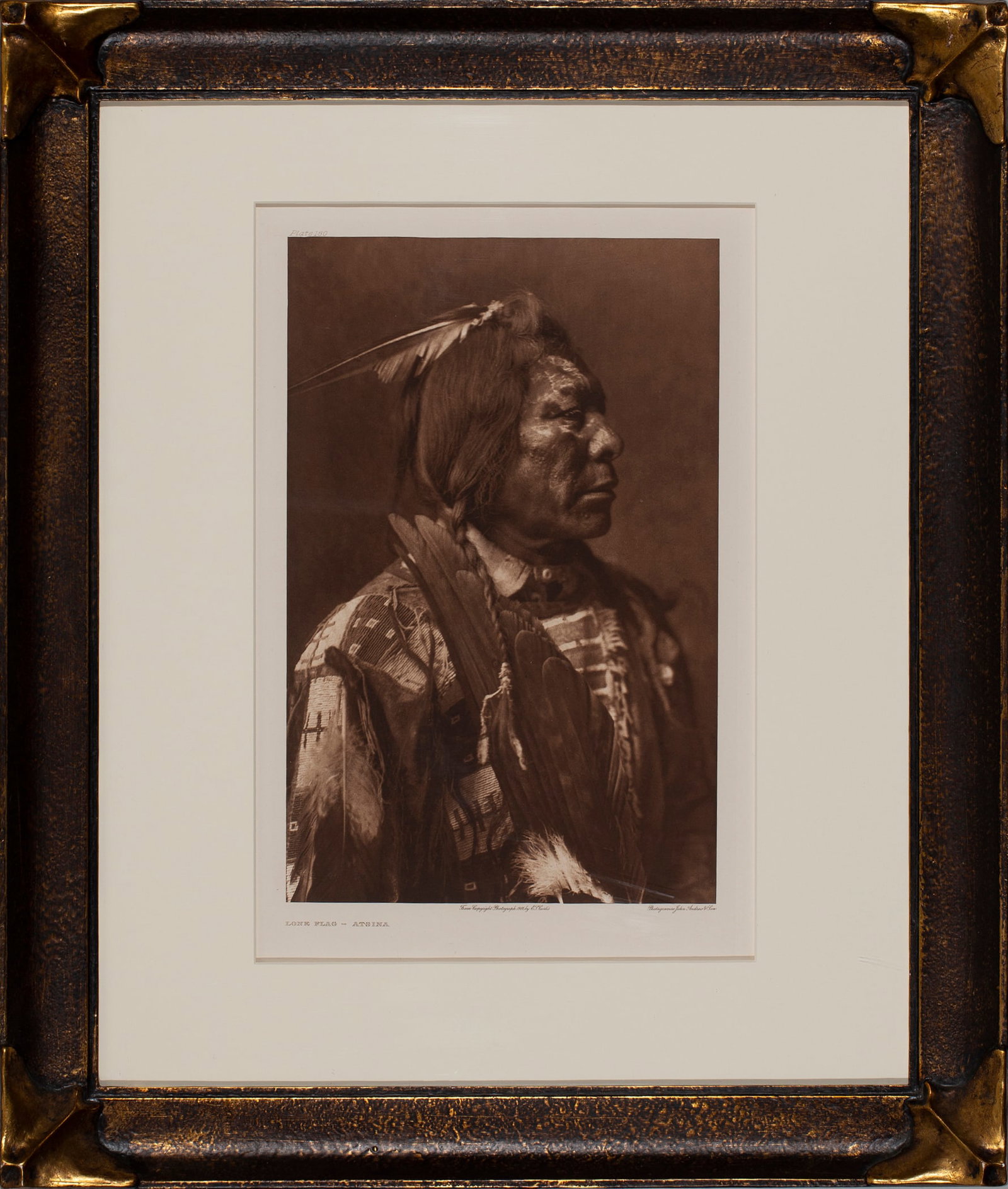 Edward S. Curtis (1868 - 1952), Lone Flag - Atsina, 1908: Edward S. Curtis (1868 - 1952) "Lone Flag - Atsina", 1908 Photogravure, Plate #180, Printed on Holland Van Gelder Paper, Batwing Stye Frame, Image: 15 3/4" x 10 1/2", Framed under glass: 28" x 24", Bo