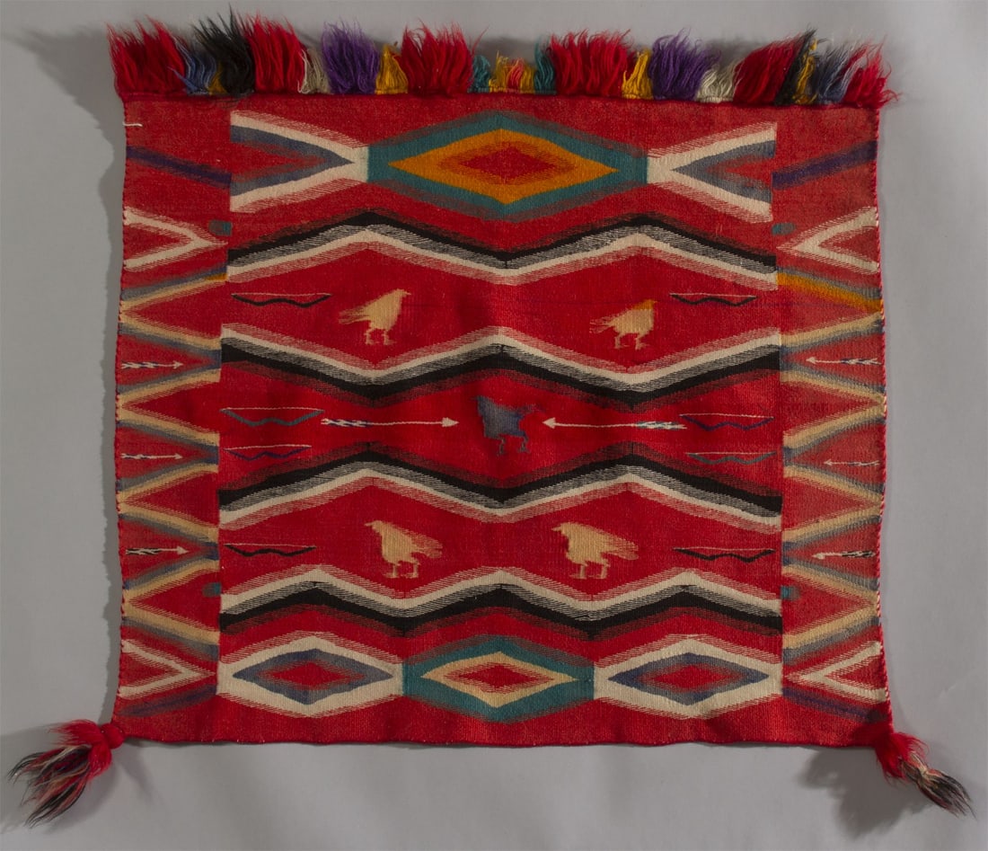 Navajo Germantown Pictorial Sunday Saddle Blanket, Ca. 1875-1880: Great old antique pictorial blanket with chickens, bows & arrows woven from a combination of early wool yarns including both 3 and 4 ply Germantown, handspun and raveled bayeta., All fringe and corner