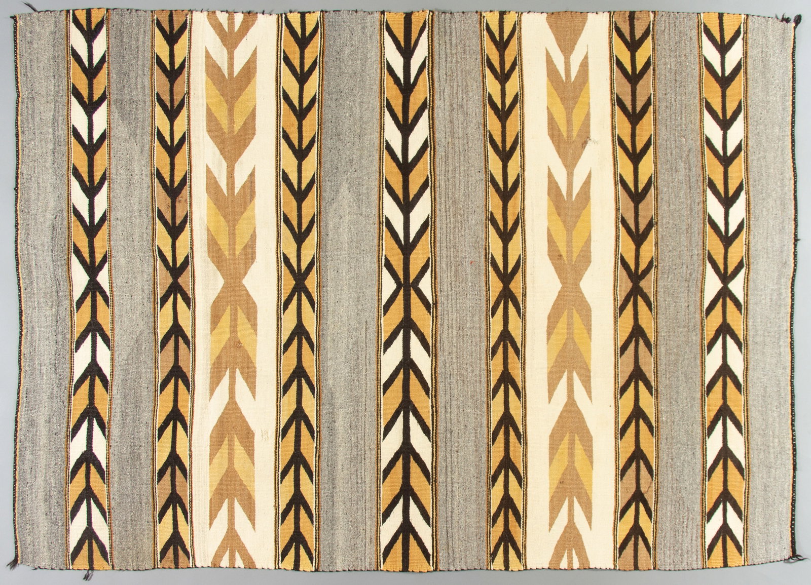 Chinle Navajo Rug, Ca. 1940: Chinle Navajo rug is made of all handspun wools, natural and aniline dyes in a banded pattern reminiscent of classic period blankets, but in a textbook Chinle color palette. Measurements: 70" x 50 1/2