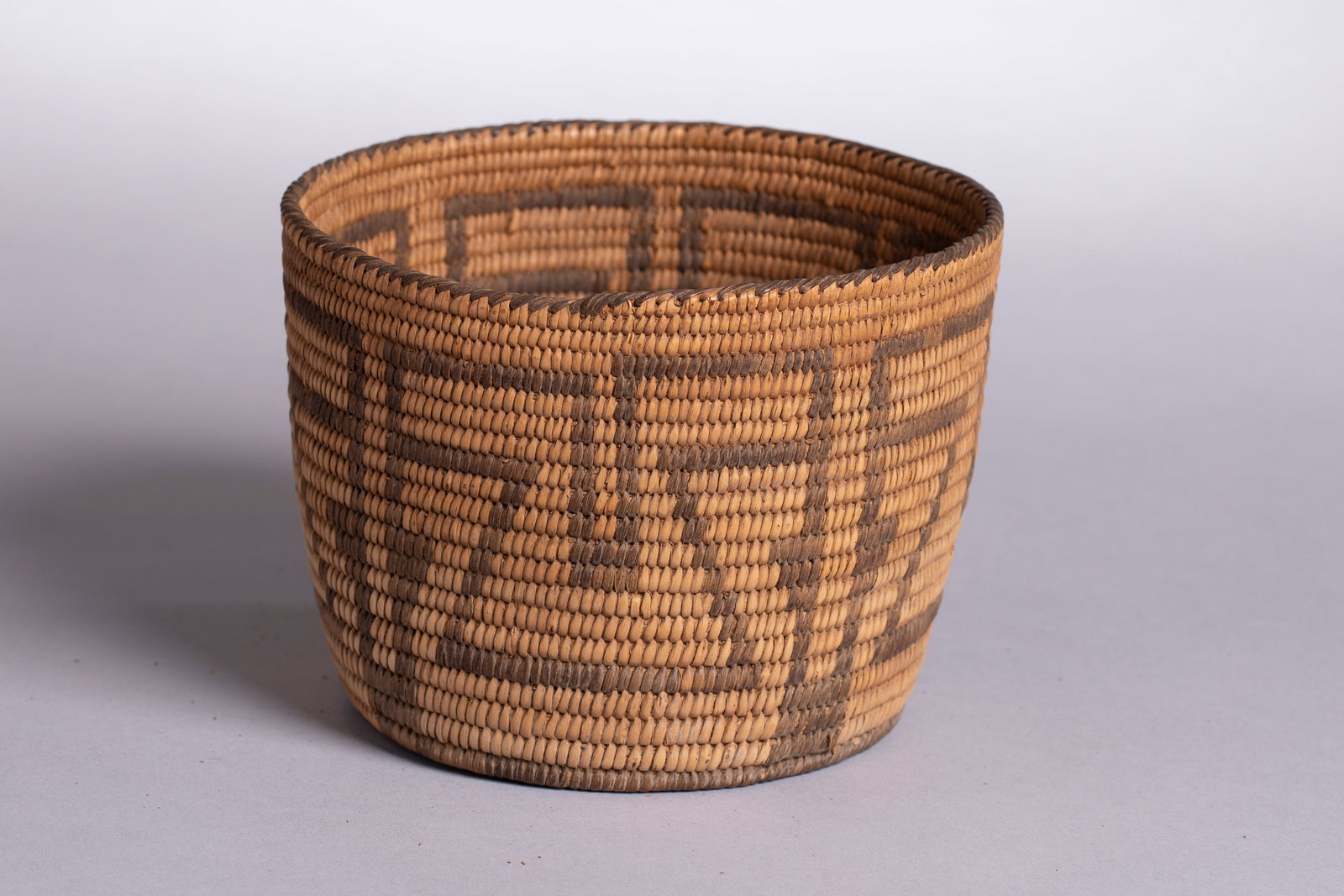 Pima Basket Bowl, Ca. Early 20th Century: Antique Pima basket bowl, Ca. Early 20th Century, Diameter 6 1/4" Height: 4 3/4". The Pima are well known for their water-tight, basket weaving techniques.