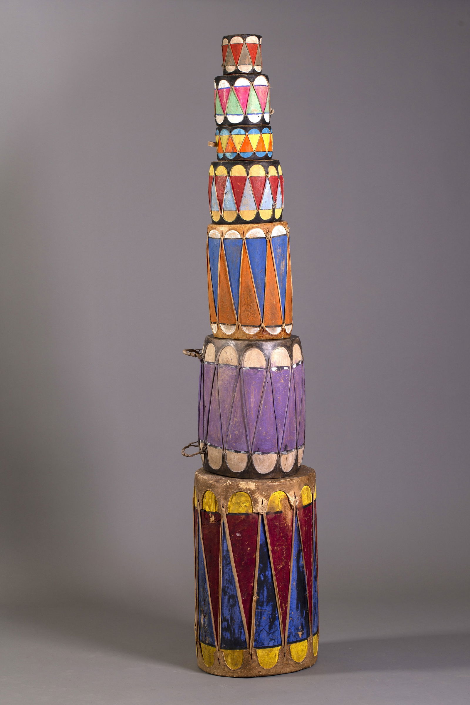 Seven Graduated Pueblo Drums: Seven graduated Pueblo drums in vibrant colors.Provenance: Salveson Collection Ohio acquired over 25-year time period.