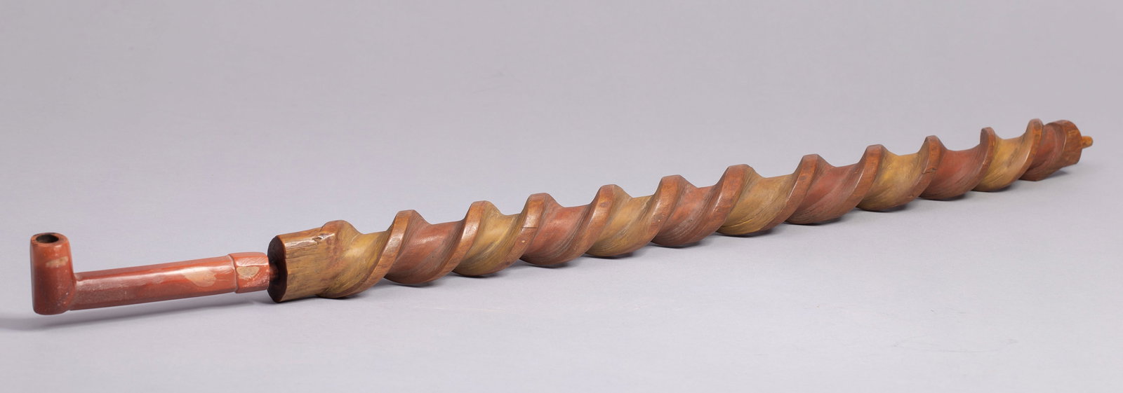Northern Plains Stem Twist Pipe, Ca. 19th Century: Northern Plains Stem Twist Pipe, Ca. 19th Century. Carved and twisted pipe stem and catlinite pipe bowl from the Plains Native American Indians. The 19th century piece shows a solid wood twisted stem.