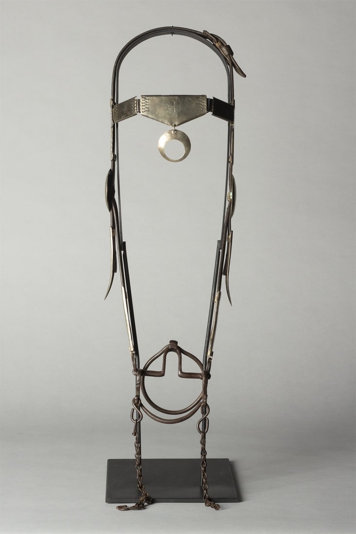Early Southern Plains Silver Bridle with Mexican Ring Bit: An early and ornate bridle with engraved German silver throughout. Matching large Naja 2" with Conchos 2 3/4"D. Complimented with a Mexican Ring Bit and custom stand. Provenance: Jackson, WY Collector