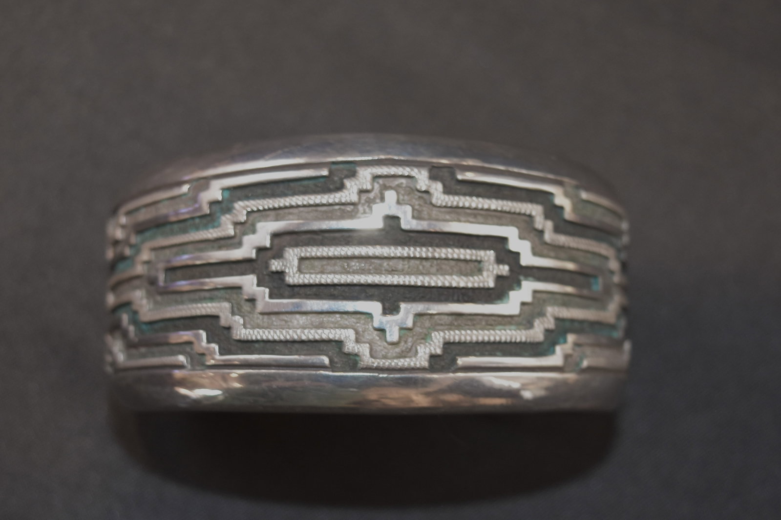 Navajo Rug Designed Bracelet by Dan Jackson: Navajo rug design by award-winning Navajo artist Dan Jackson, whose mother was Bernice Charlie, a fine weaver who inspired his designs. Very heavy silver. (See also the matching belt buckle and bolo t