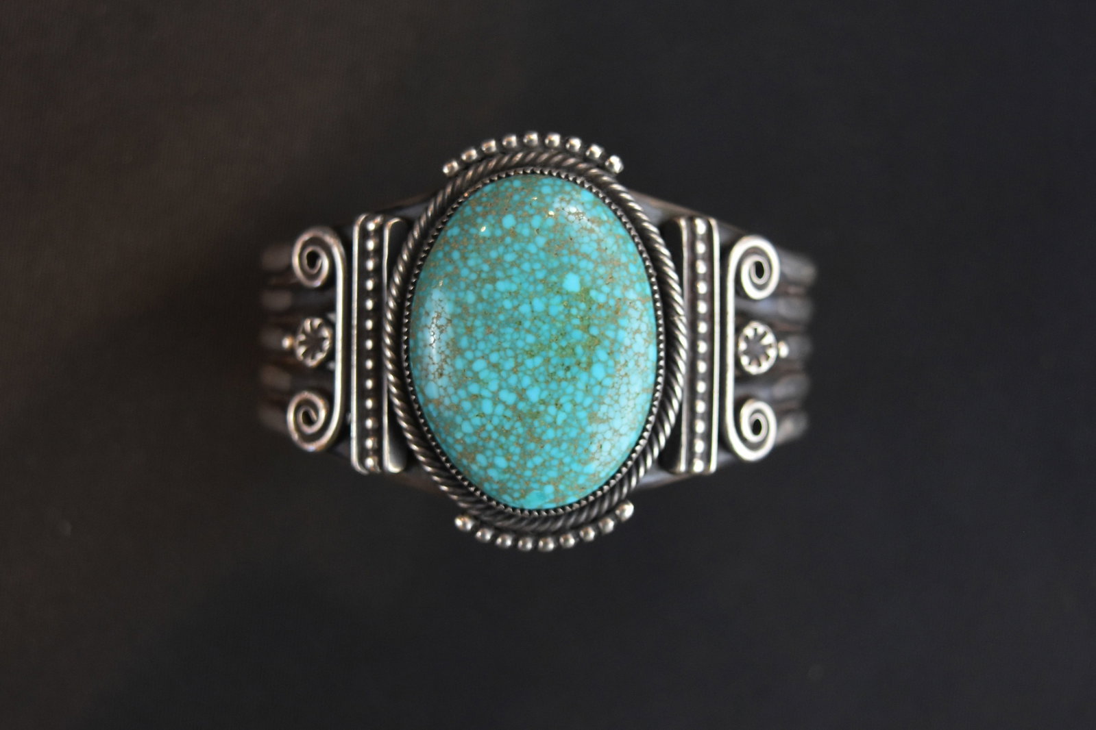 Large Oval Matrix Kingman Turquoise with twisted silver bracelet by Steven Arviso: By Steven Arviso, contemporary Navaho from Gallup, who is particularly attuned to the quality and beauty of the gemstones. Diameter: 6", Gap: 1 1/8"