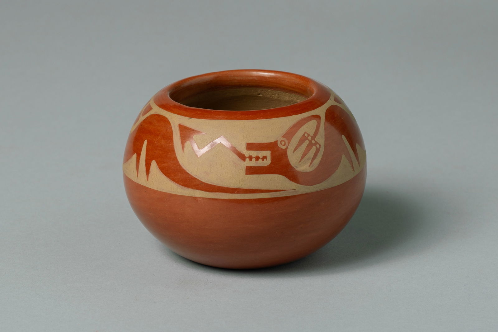 San Ildefonso Jar, Maria Martinez (1887-1980): San Ildefonso Jar, Maria Martinez (b.1887 - d.1980) and Popovi Da (b.1923 - d.1971) Highly polished red and sienna with painted avanyu encircling neck and shoulder of jar. Maria Martinez is unquestion