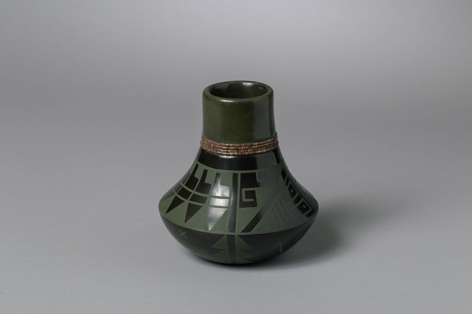 San Ildefonso Green and Black Jar, Erik Fender (b. 1970): San Ildefonso Green and Black Jar, Erik Fender AKA Than Tsiden (b. 1970) winner of first place for his pottery, painting, and sculpture at the Santa Fe Indian Market. This is one of his green on black