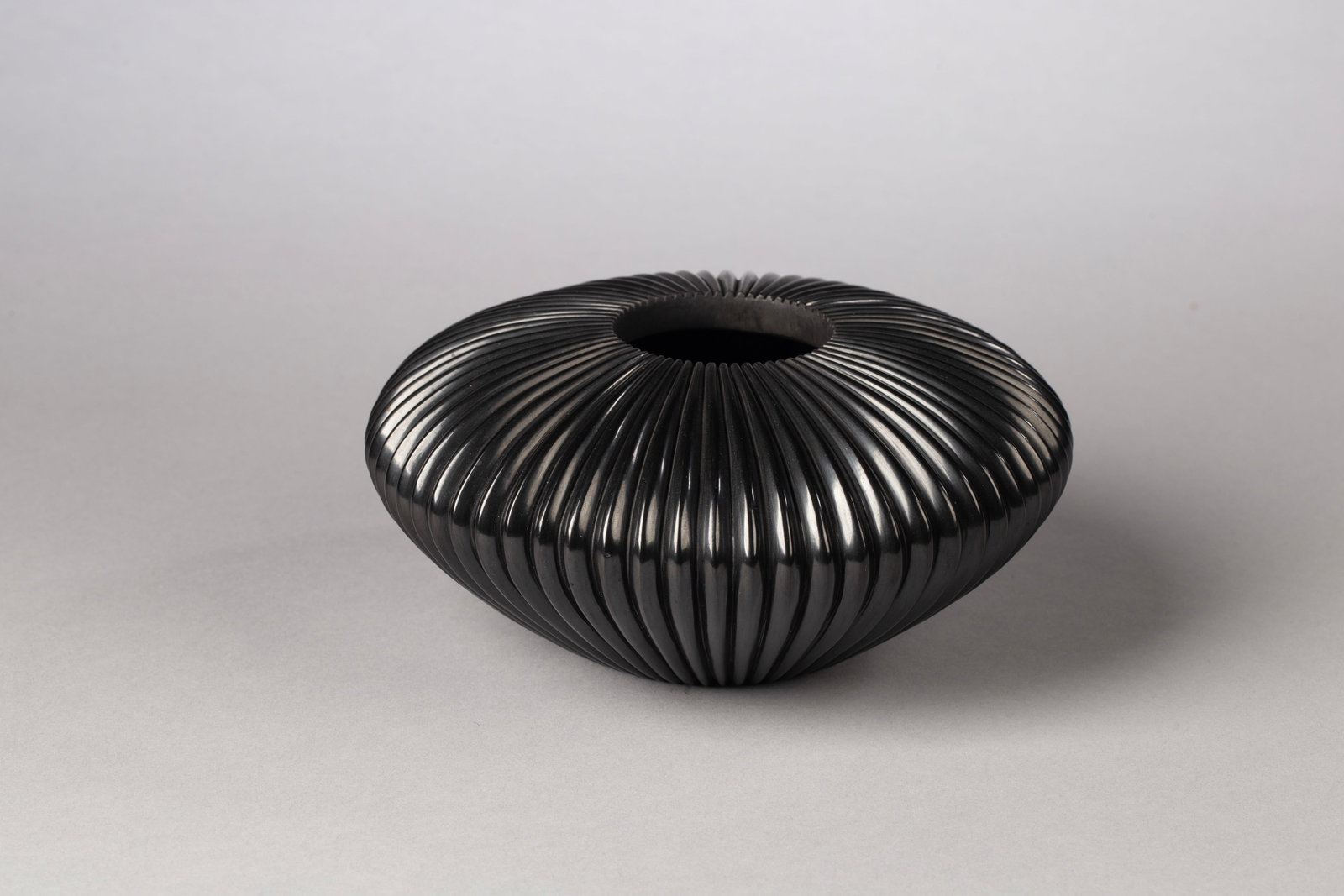 Santa Clara Polished Black Bowl, Nancy Youngblood (b. 1955): Santa Clara Polished Black Bowl, Nancy Youngblood (b. 1955) granddaughter of legendary potter Margaret Tafoya, Nancy is renowned for her deeply carved, highly polished vessels with their elegant, rhyt