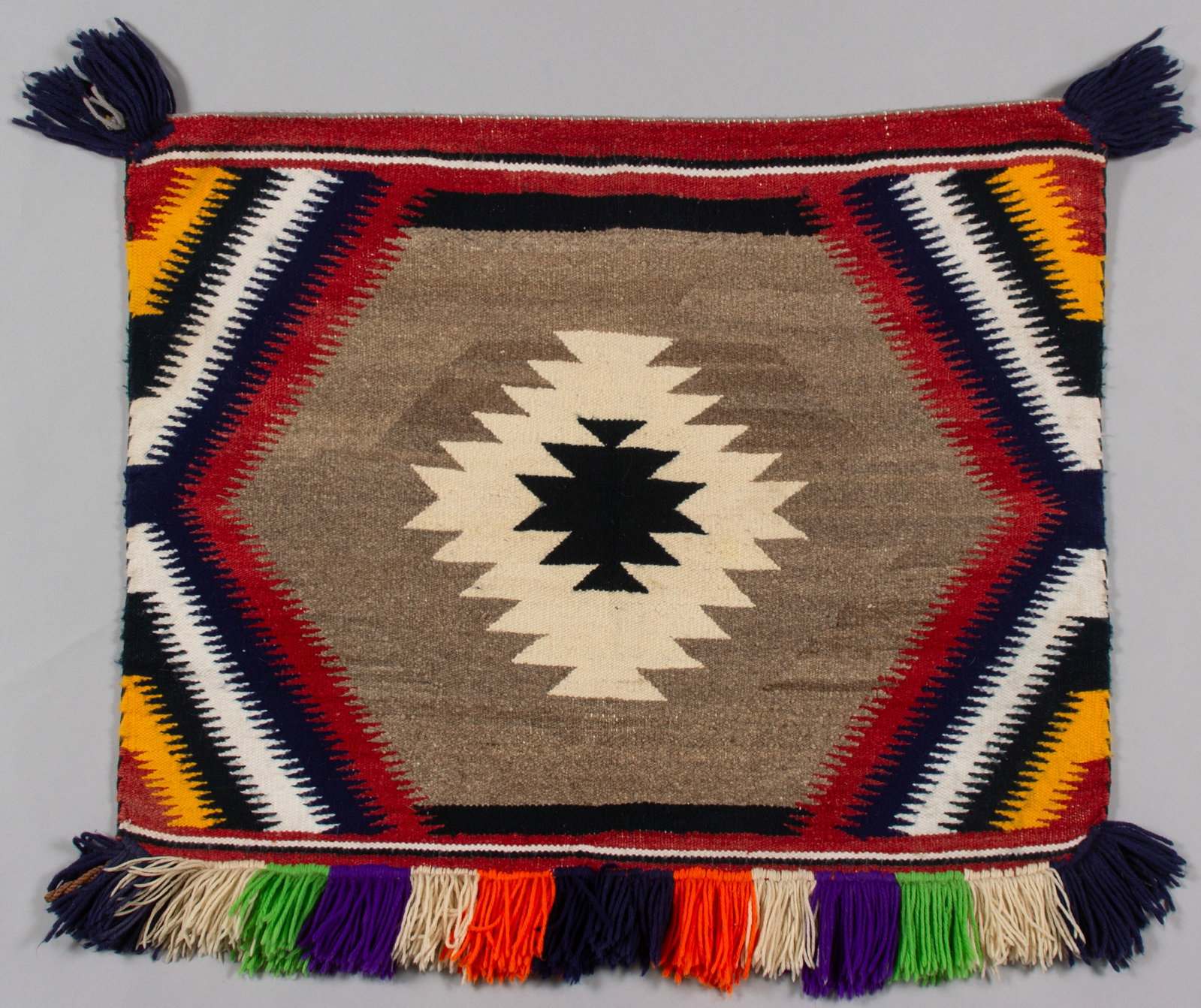 Colorful Sunday Saddle Blanket: Colorful Sunday saddle blanket Ca. 1950-1960s34 x 26"; Provenance: Friends of Hubbell, Present: Private New Mexico Collection