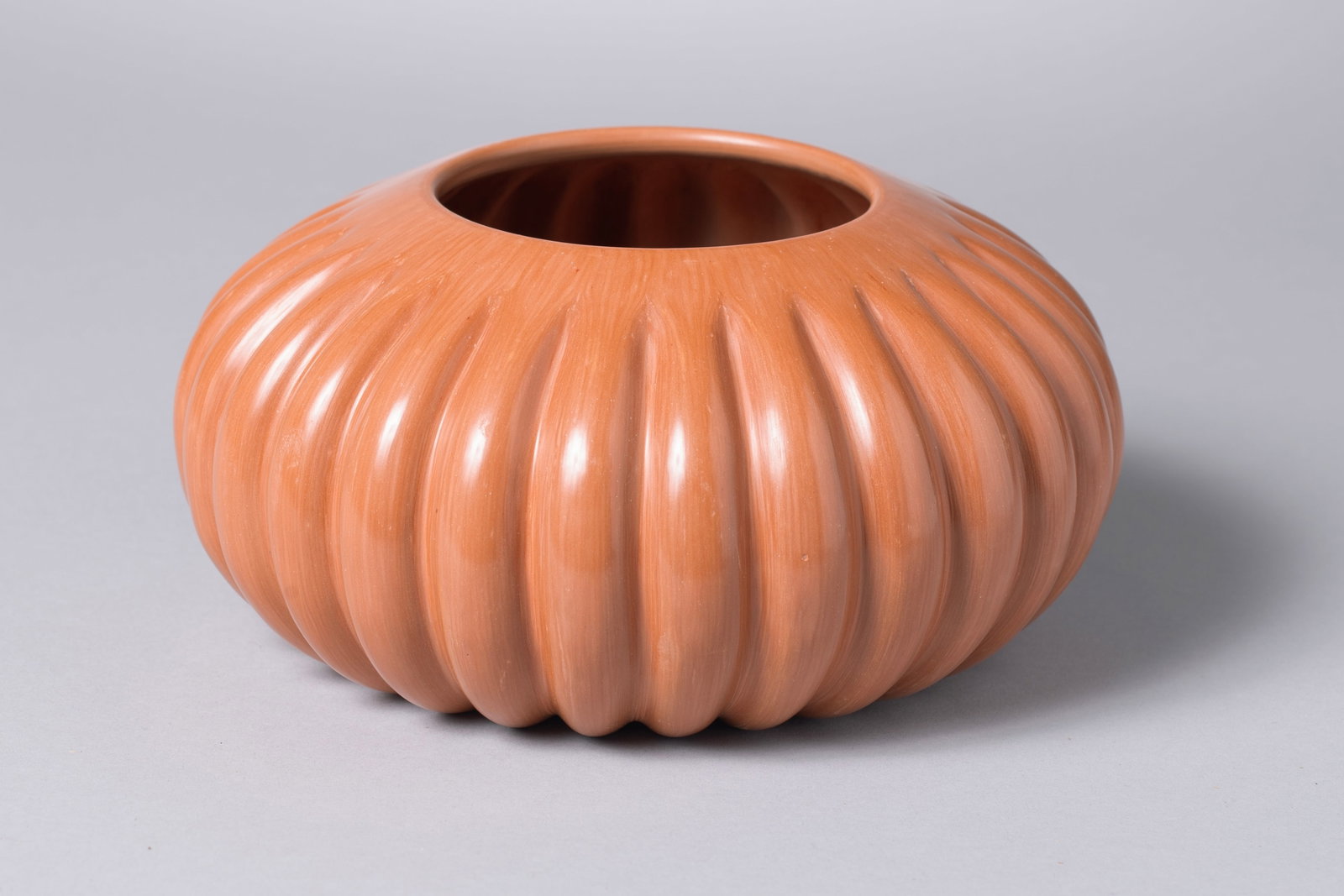 Hopi Tewa Polished Sienna Melon Jar, Alton Komalestewa (b. 1960): Hopi Tewa Polished Sienna Melon Jar, Alton Komalestewa (b. 1960) Alton uses mainly Hopi clay which he polishes directly or uses with red Rio Grande slip. He is a master of the firing process, smudging
