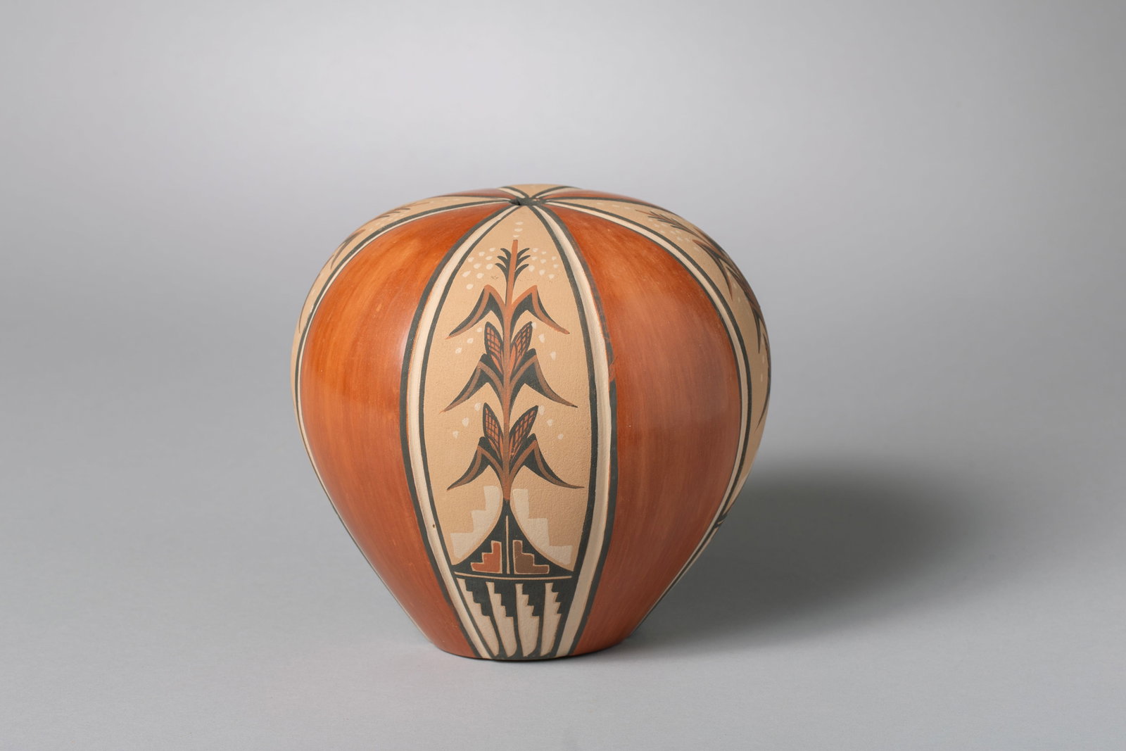Contemporary Jemez Seed Pot, Virginia Fragua (b. 1961): Jemez Seed Pot, Virginia Fragua AKA Ponca Flower (b. 1961) Specializes in hand coiled melon styled pottery, She polishes her pottery to a nice shine. This melon shaped vessel featuring eight "ribs", f