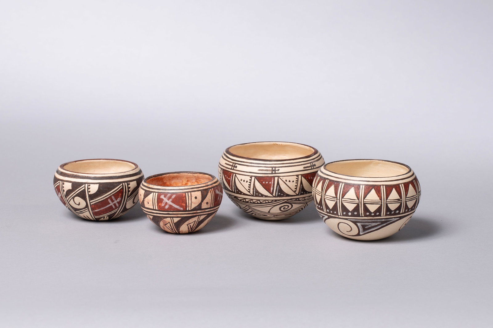 Lot of Four Hopi Polychrome Bowls: Four Hopi Bowls, Delaine Tootsie Chee (b. 1962) of the First Mesa Village of Sichomovi on the Hopi Reservation and is a member of the Roadrunner Clan. She is the winner of numerous awards for her pott