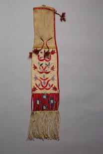 Santee Sioux Quilled Pipe Bag, Ca. 1880s-90s: Constructed in a tappered design on native tanned hide, sinew sewn and porcupine quill decorated. There are red dyed quill wrapped drops with tin cones and feathers, a greasy yellow bar leading to a l
