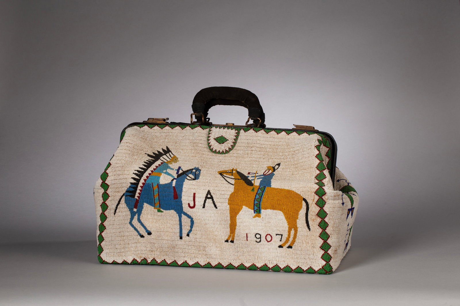 Large Sioux Fully Beaded Doctor's Bag, Ca. 1907: Large in size and fully beaded pictoral doctor's bag. With a white beaded background decorated with four warriors on horseback. Two of the warriors are wearing a full headdress. Note the warriors are 