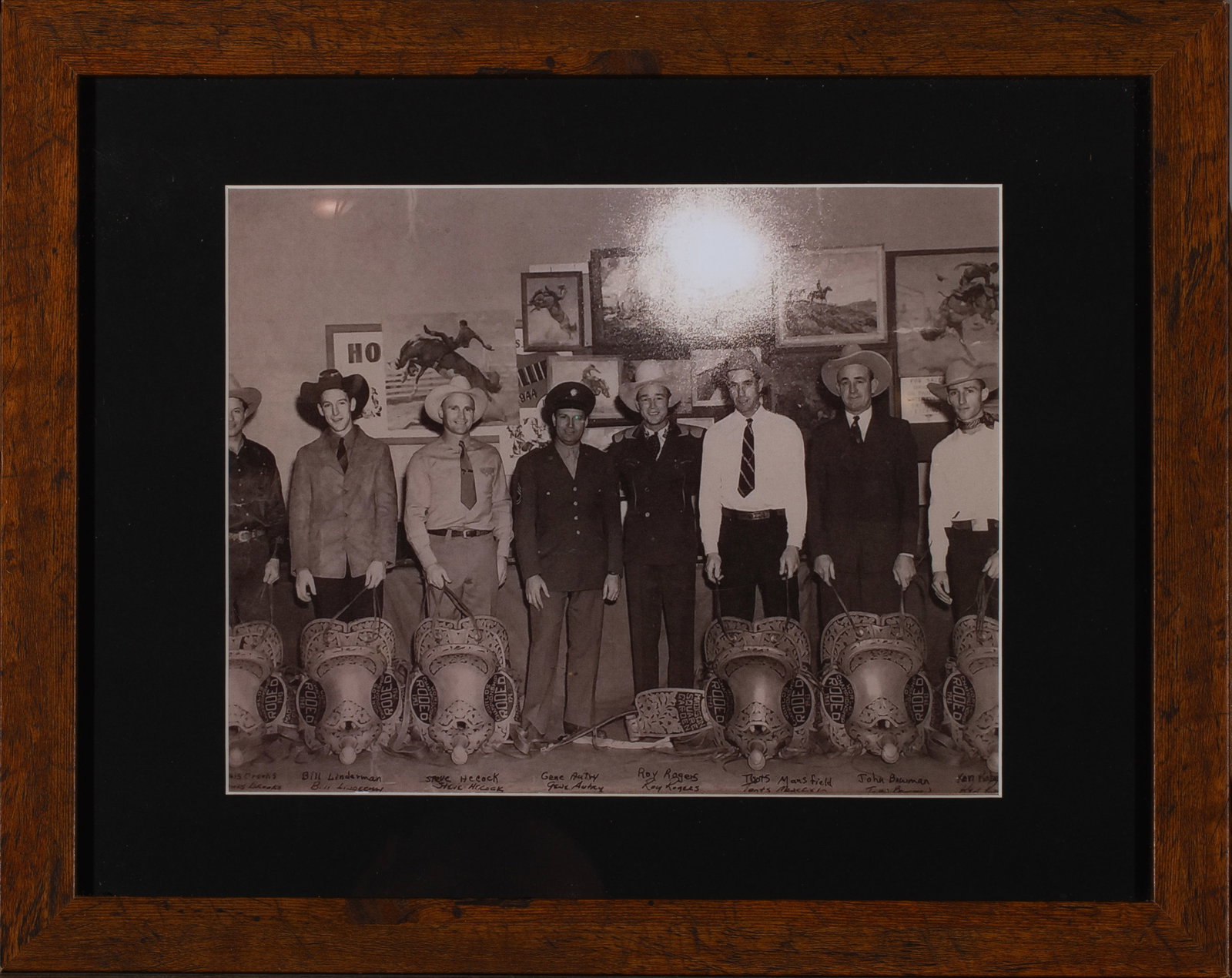 Framed Vintage Photo of Roy Rogers, Gene Autry and others: Vintage Photo of Roy Rogers, Gene Autry, Bill Linderman, Steve Hickock, Tents Mansfield, John Beurman, and other Stars with Rodeo Saddles; Framed: 15.75 x 12.5"