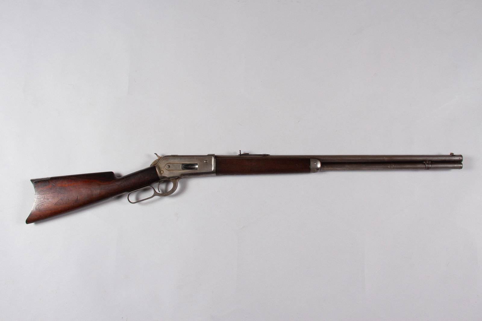 Antique Winchester Model 1886 Rifle: Winchester Model 1886 rifle, .38/56 WCF, made in 1889, 26" round barrel, gray patina on barrel and receiver, nice wood with no visible chips or cracks, all markings are clear and legible, action stron