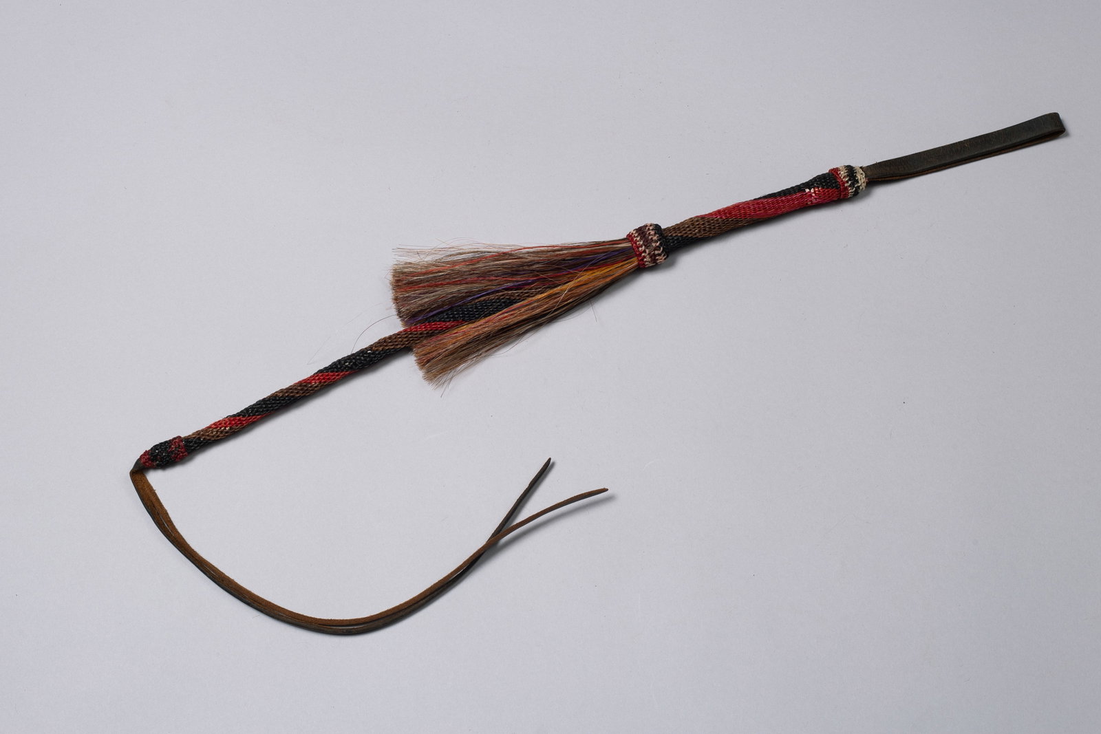 Early Horsehair Quirt: Stunning vintage horsehair quirt. Intricately woven, bold colors and 42"Length