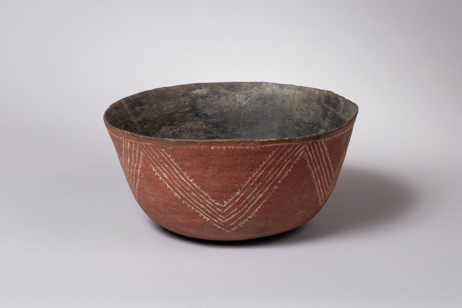 Large Interesting Salado Bowl, Ca 1250 - 1450 AD: Huge stunning Salado polychrome bowl represents a peak of prehistoric Southwestern ceramic artistry. The hand-coiled, large redware vessel features a beautifully executed white design on its exterior,