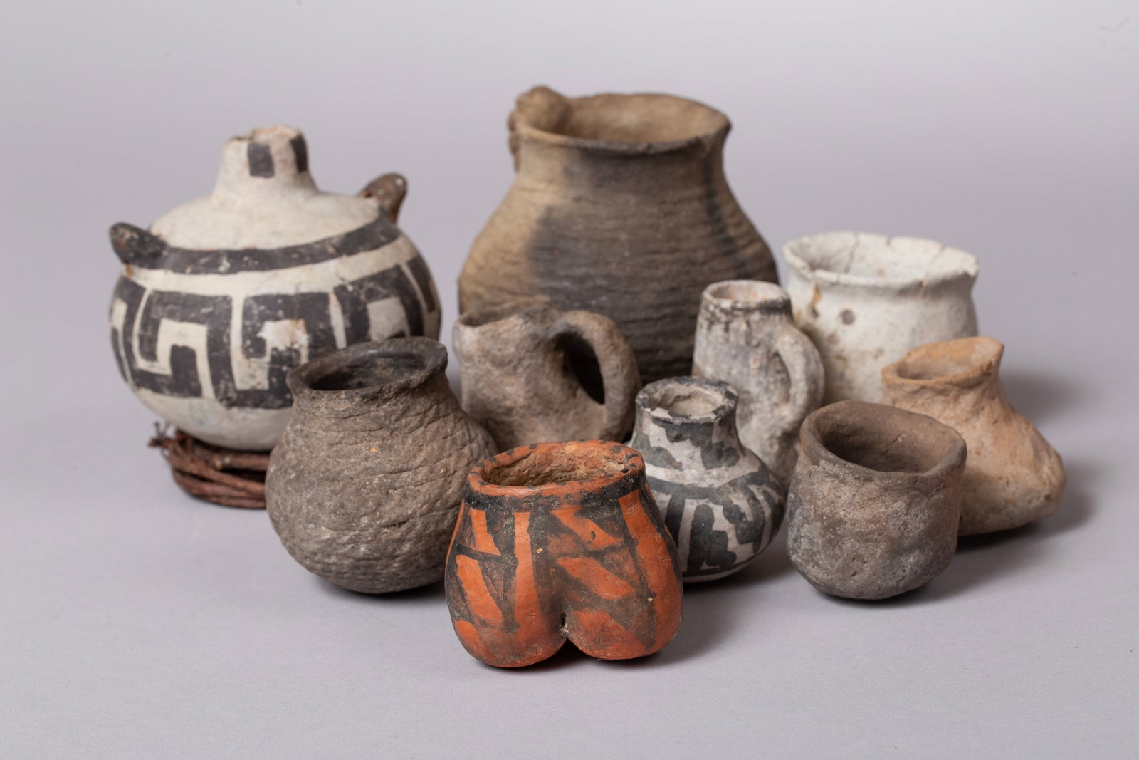 Group of Ten Anasazi Small Pots: Group of Ten Anasazi Small Pots in various states of condition and ages; some quite unique items: A.) Snowflake b/w Canteen , small with great paint and 2 lugs 4" D , 3 1/2" H B.) Gila Red Ware painte
