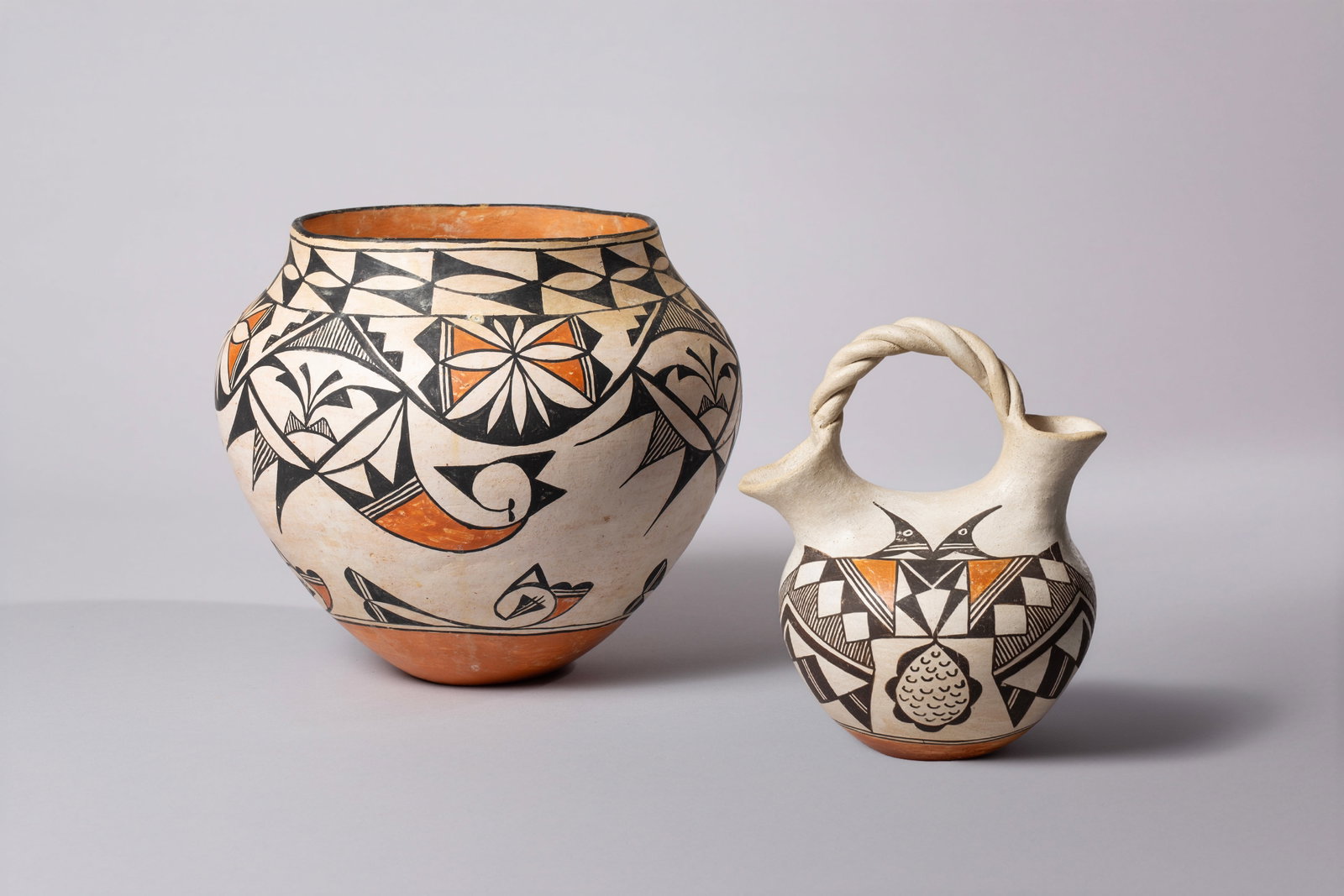 Two Acoma Pots Including a Wedding Pot by Lupe Paytiamo and Pot by S. Martinez: Two Acoma Pots A) Pot by Acoma N.M., S. Martinez 10"D, 9"H B) Wedding Pot by Lupe Paytiamo 5"D, 8"H