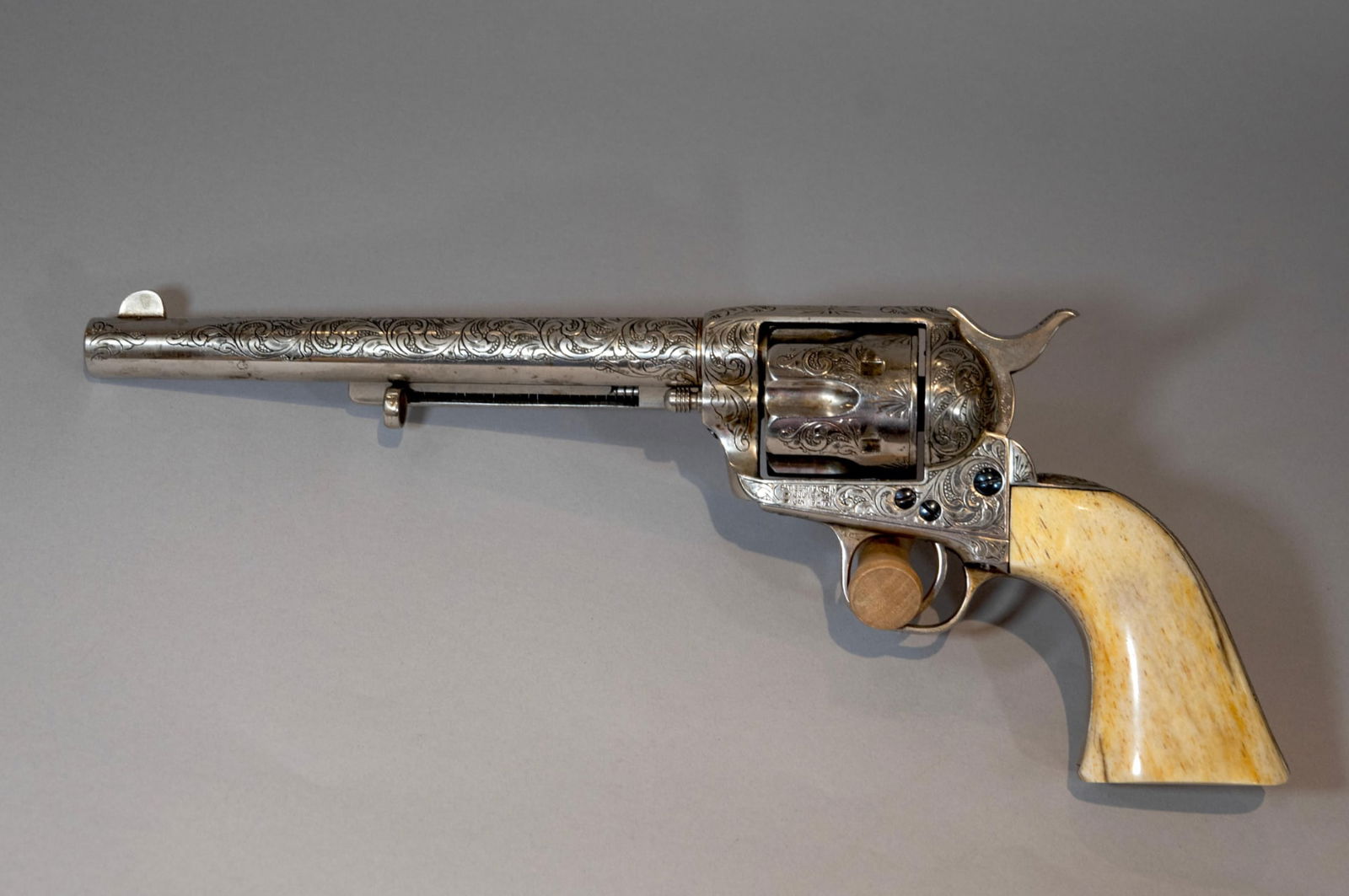 Antique Colt Single Action Army Revolver engraved by D.W. Harris with Bone Grips, Made 1882: A truly exceptional and historic first-generation Colt Single Action Army (SAA) revolver manufactured in 1882, a pivotal year in American history. This is not a standard production piece; it features