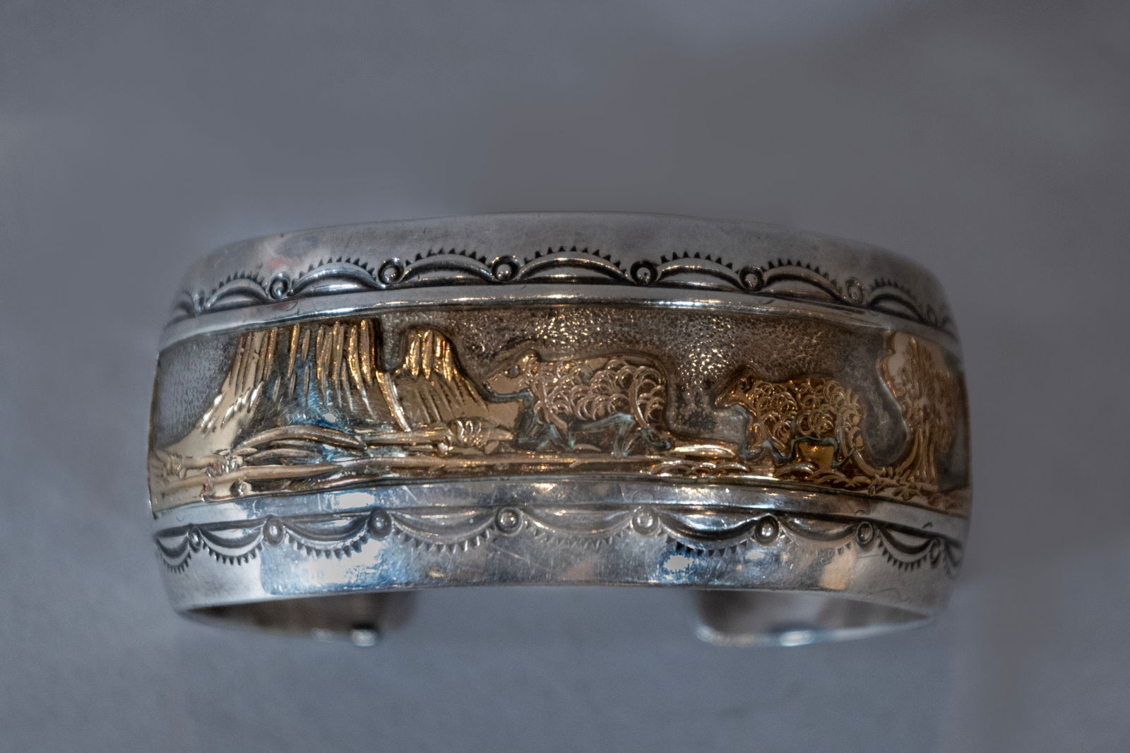 Vintage Navajo Silver & Gold Storyteller Cuff by Wilbur Wauneka: Vintage Navajo storyteller cuff bracelet masterfully crafted in sterling silver and gold. This unique piece was created by the respected Navajo artist Wilbur Wauneka, as confirmed by his "W over STERL