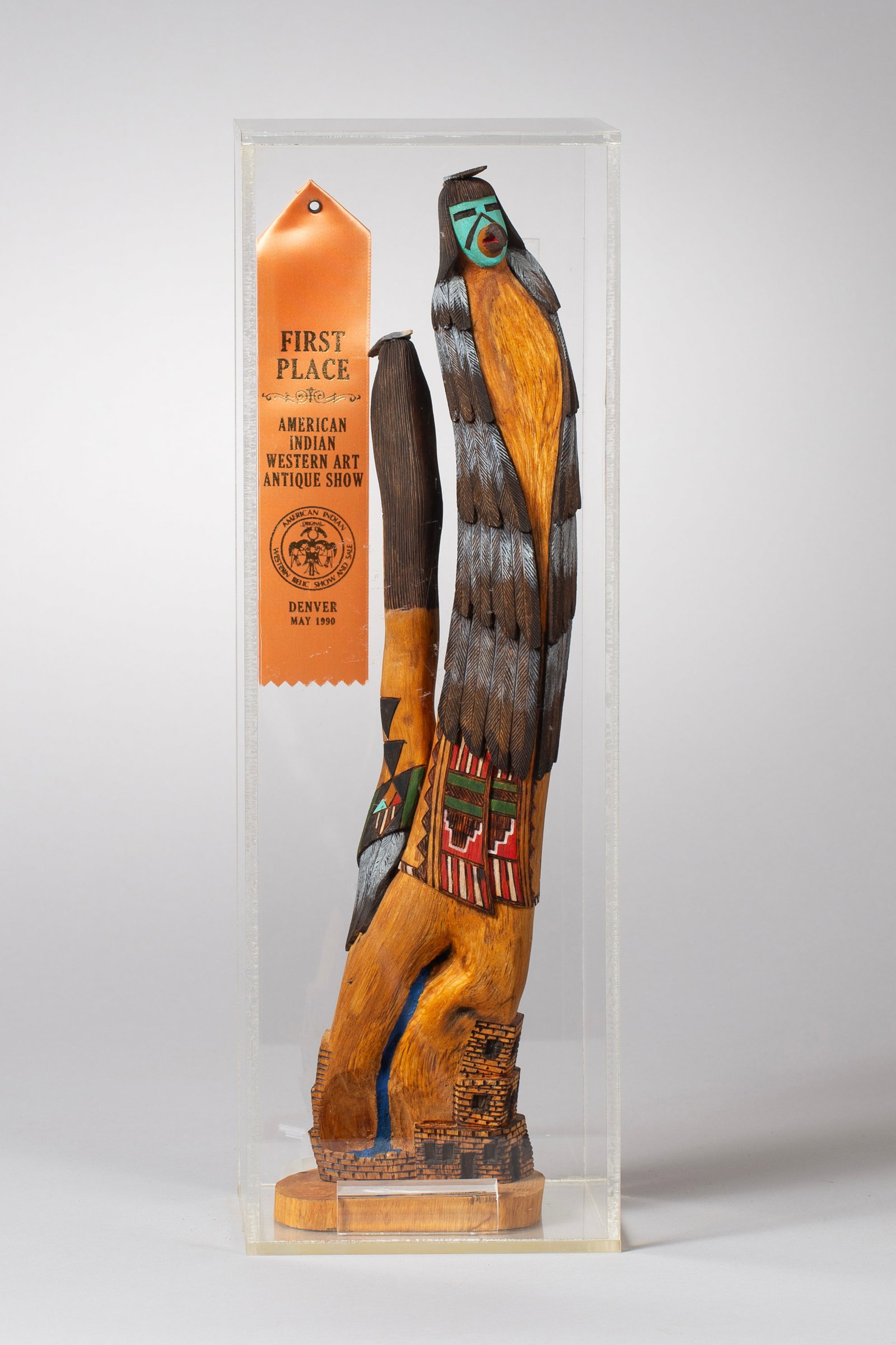 Award Winning Katsina (Kachina) in Shadow Box by Fernando Puhuhefvaya (b.1963): Fernando Puhuhefvaya (b.1963) First Place Award American Indian Western Art & Antique Show Denver May 1990 Made of Cottonwood Root, measurements: acrylic box 19 1/2”h x 6 1/2”w x 5 1/2