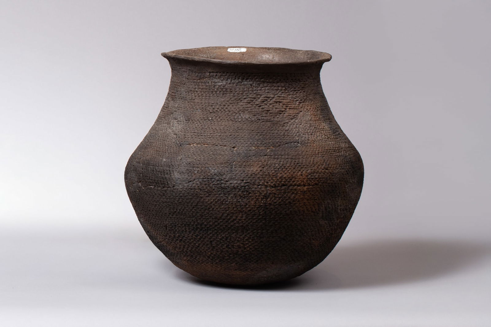 Large Ancient Anasazi Corrugated Olla Cooking Pot, Ca 1100 - 1300 AD: Large Ancient Anasazi Corrugated Olla Mogollon Cooking Pot, Ca 1100 - 1300 AD Details: - Ancient Anasazi - Corrugated Olla Cooking Pot - Red Clay - Dark - 14"D, 13"H Description: - The corrugated text