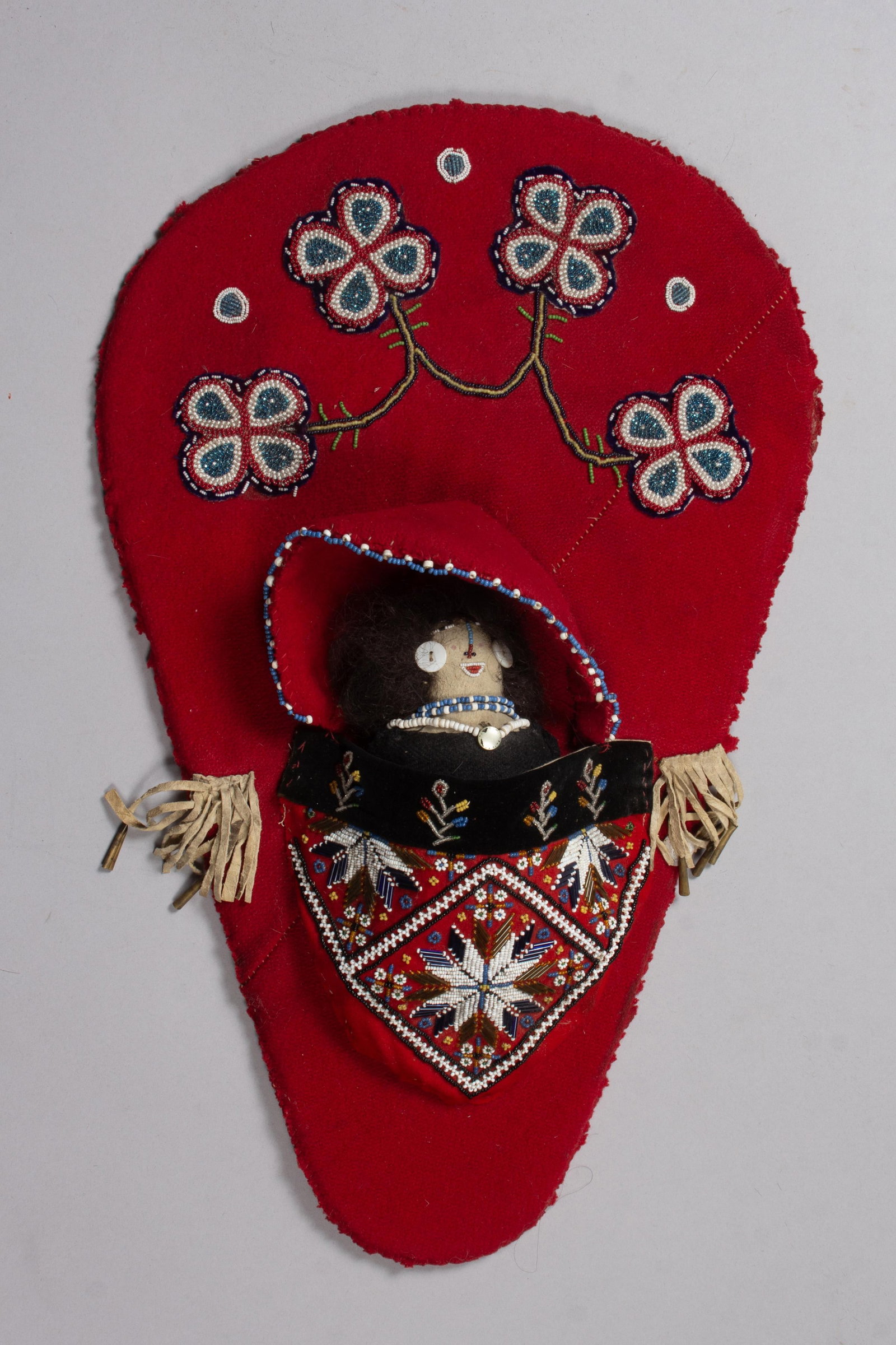 Cradleboard with doll, 4 x 14 1/2 x 23 in. (10.2 x 36.8 x 58.4 cm.) (1 of 3)