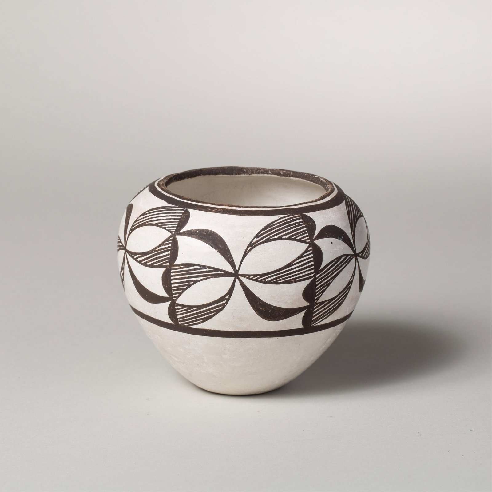 Lucy M. Lewis, Acoma Bowl: Traditionally crafted bowl made by revered Acoma potter Lucy Lewis, featuring black painted floral design elements over a cream slip. Thinly walled which is characteristic of Acoma pottery. The