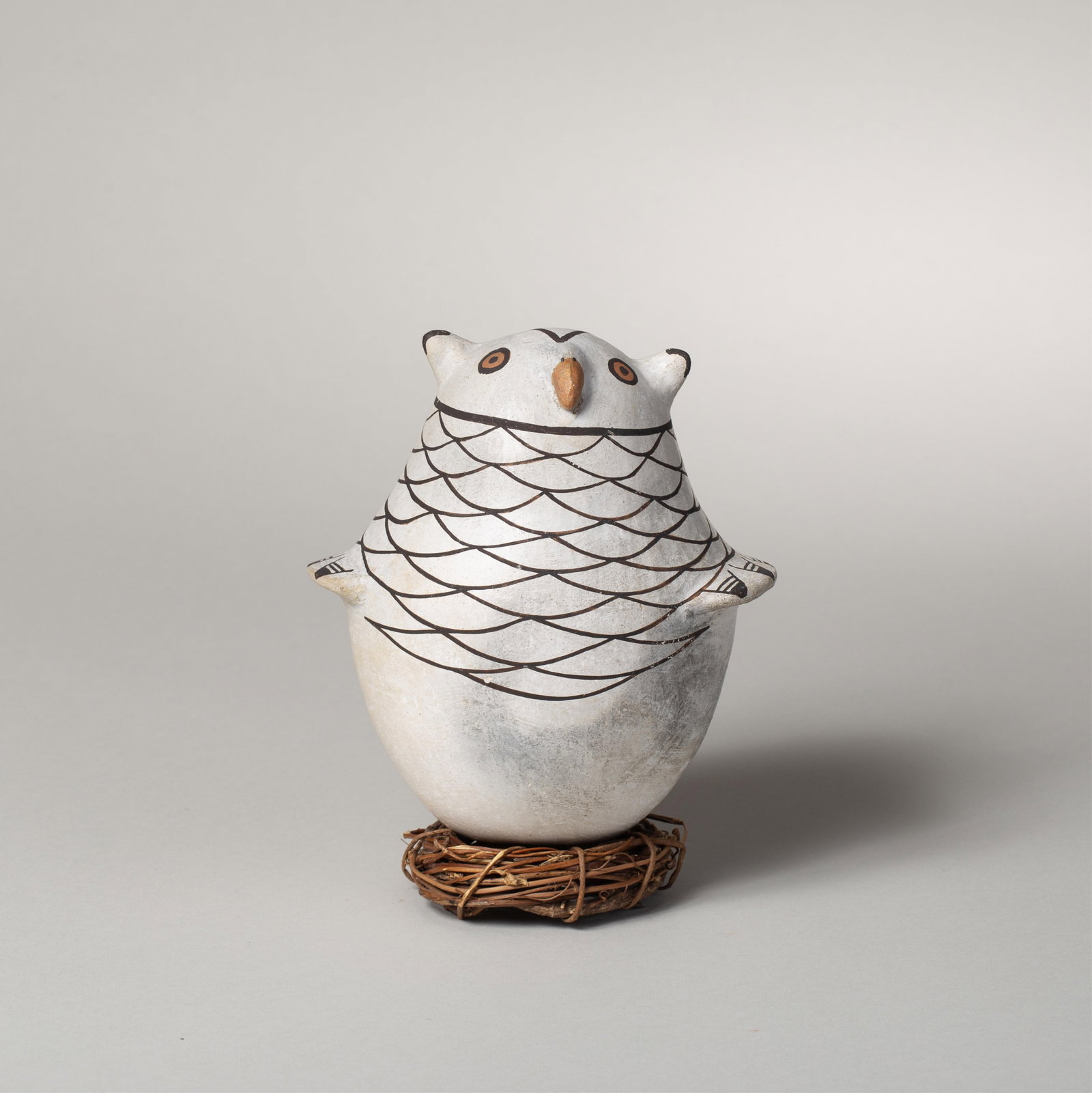 Marie Zieu Chino (1907-1982), Acoma Owl: Whimsical owl figurine designed by renowned Acoma potter Marie Zieu Chino, friend of Lucy Lewis, depicting a portly bird with hand painted torso and wings, wide eyes and a protruding beak. The dark,