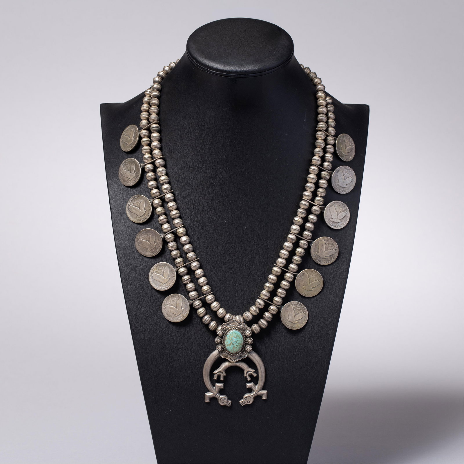 Jim Red Feather Navajo Sterling Silver Coin Necklace ? Double Yei Naja with Turquoise: Jim Red Feather Navajo Sterling Silver Coin Necklace ? Double Yei Naja with TurquoiseDin? (Navajo), late 20th centuryA substantial Navajo sterling silver coin necklace by master silversmith Jim Red Fe