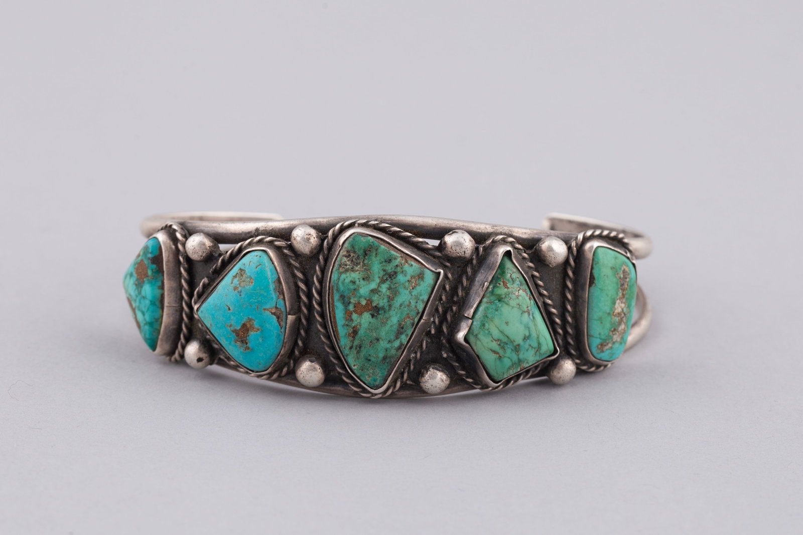 A Vintage Diné (Navajo) Silver and Five-Stone Turquoise Row Cuff Bracelet (1 of 4)
