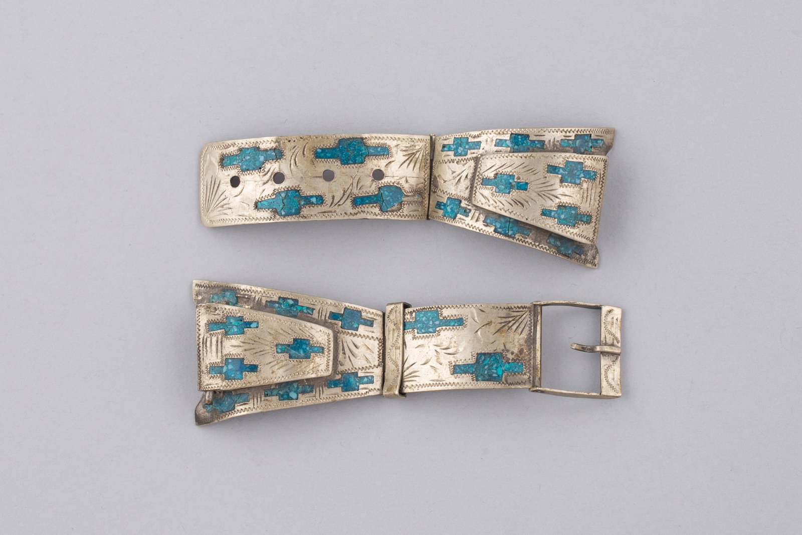 Vintage Navajo Sterling Silver & Inlay Turquoise Watchband Tips: Navajo sterling silver and turquoise watchband bracelet featuring engraved silver panels inlaid with turquoise chip designs in repeating cross motifs. The bracelet is further decorated with hand-stamp