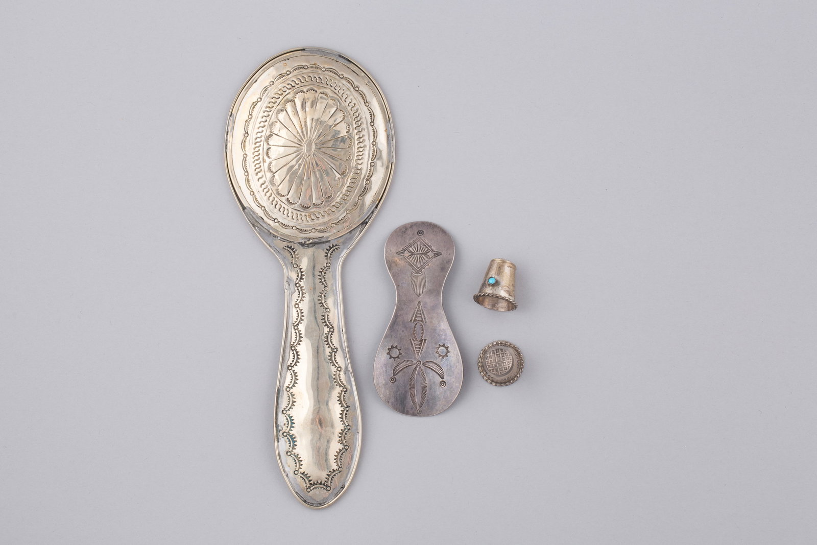 Rare 4-Piece of Navajo Silver – Hand-Stamped Hand Mirror, Shoehorn, and Two Thimbles (Incl. (1 of 5)