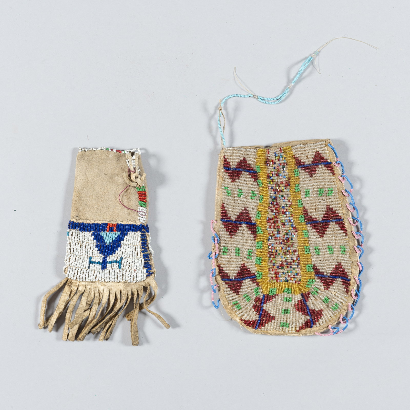 A Pair of Northern Plains Beaded Hide Pouches (1 of 2)