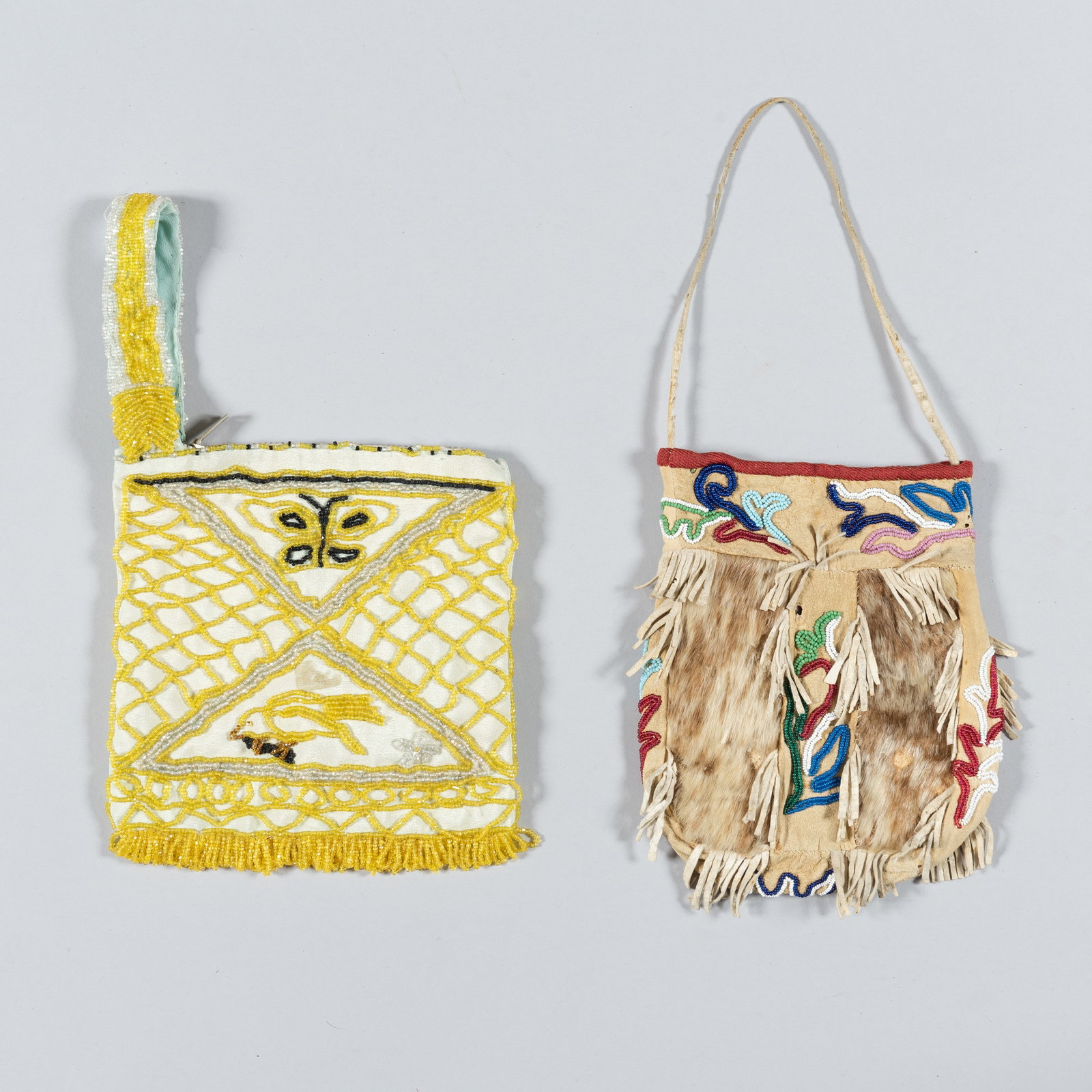 Two Southeast Alaskan Tlingit Style Beaded Bags: This lot features two distinct Native American pouches, likely of Tlingit or Northwest Coast origin, showcasing traditional beadwork and hide construction from the late 19th to early 20th century.