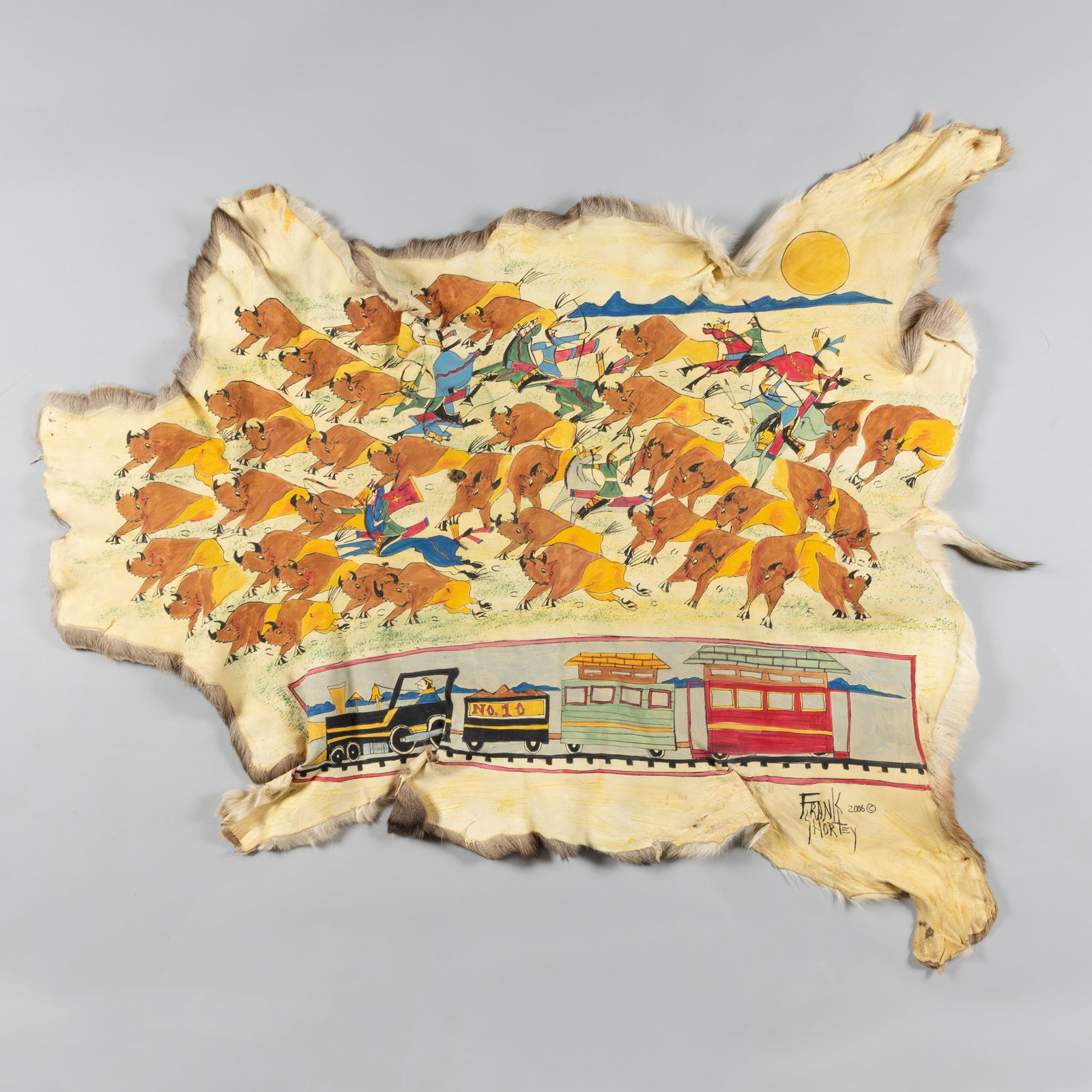 Frank Shortey, (1964 - 2007), Train No. 10 and Buffalo Hunt Scene, 2006: Signed and dated lower right: Frank Shortey / 2006 (c)This impressive work by Frank Shortey captures a dynamic, culturally layered scene painted directly on a natural deer-hide canvas. The upper