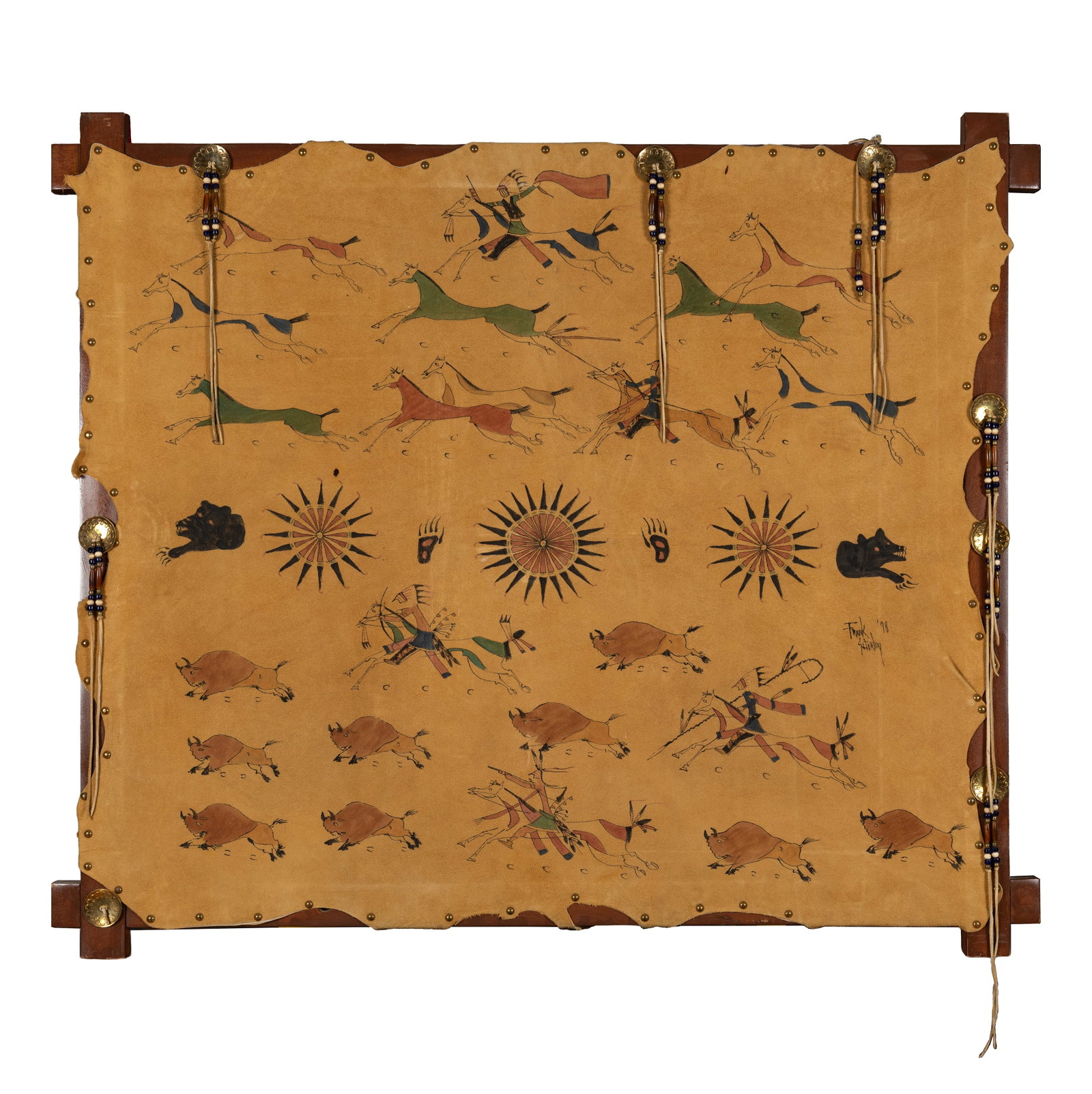 Frank Shortey (1964 - 2007), Painted Hide Wall Hanging, Stretched hide with wood frame and brass: Frank Shortey painted hide wall hanging, executed on a stretched hide panel mounted within a wood frame with tack decoration and beaded drops. The composition depicts mounted hunters pursuing buffalo 