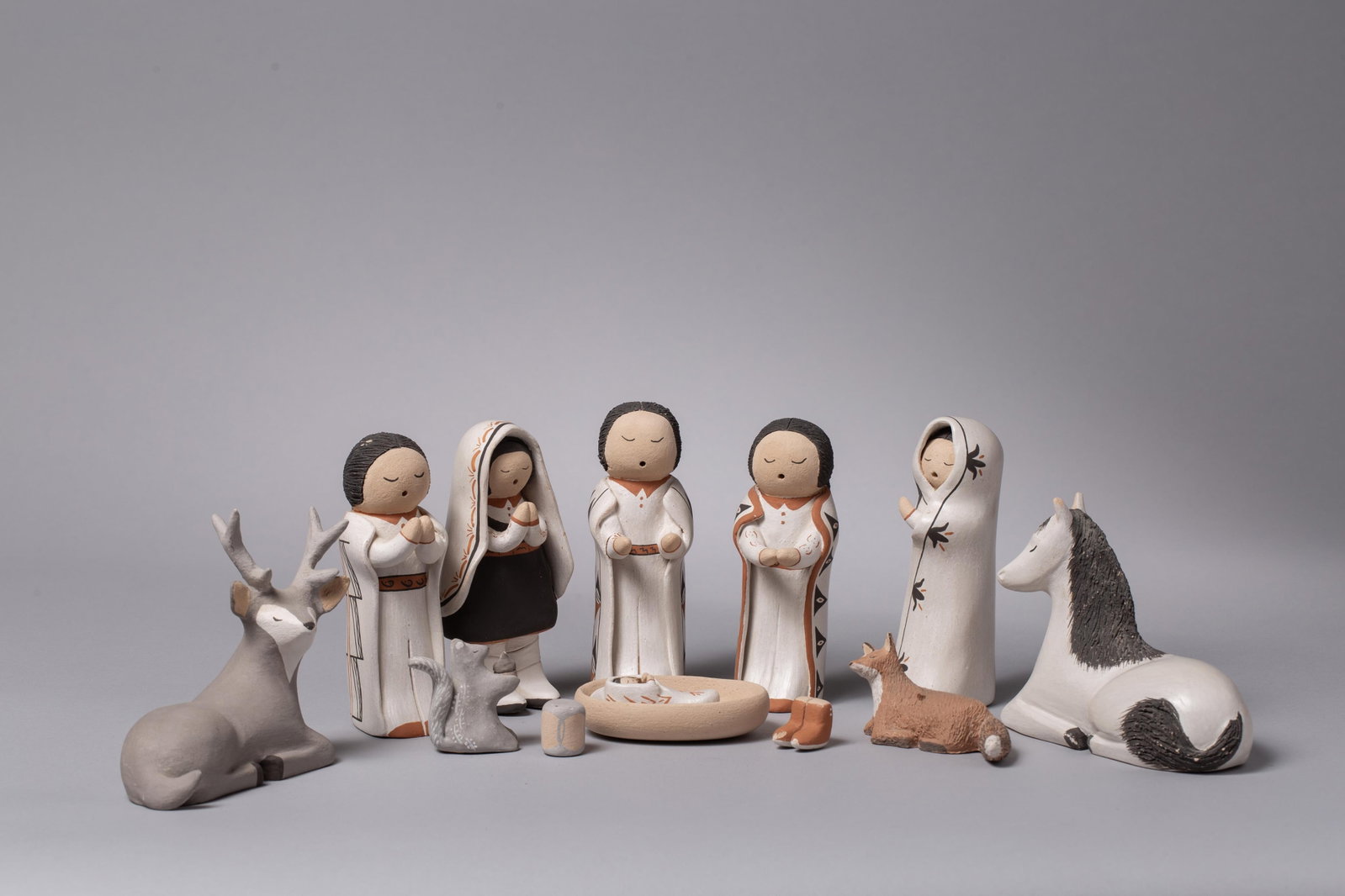 Robin Teller, Isleta Pueblo (b. 1954), Isleta Pueblo Polychrome Pottery Nativity Group, Polychrome: IA finely crafted twelve-piece polychrome pottery Nacimiento (Nativity Set) by celebrated Isleta Pueblo artist Robin Teller. This comprehensive assembly beautifully showcases the distinctive, traditio