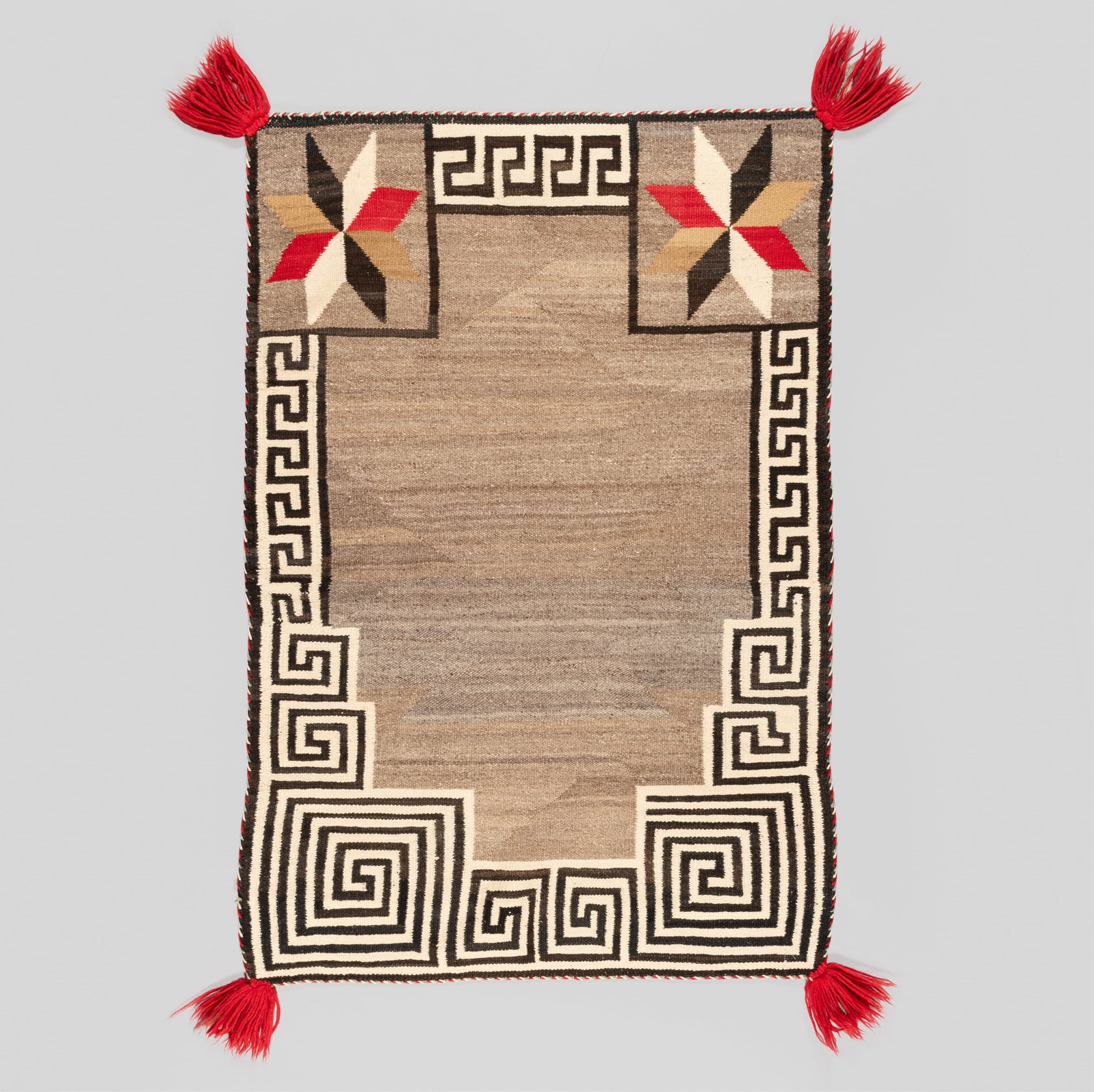 Navajo Rug Double Saddle Blanket: An exceptional and highly graphic Diné (Navajo) handwoven double saddle blanket from the early 20th century. This well-balanced textile features a central variegated grey field enclosed by a striking