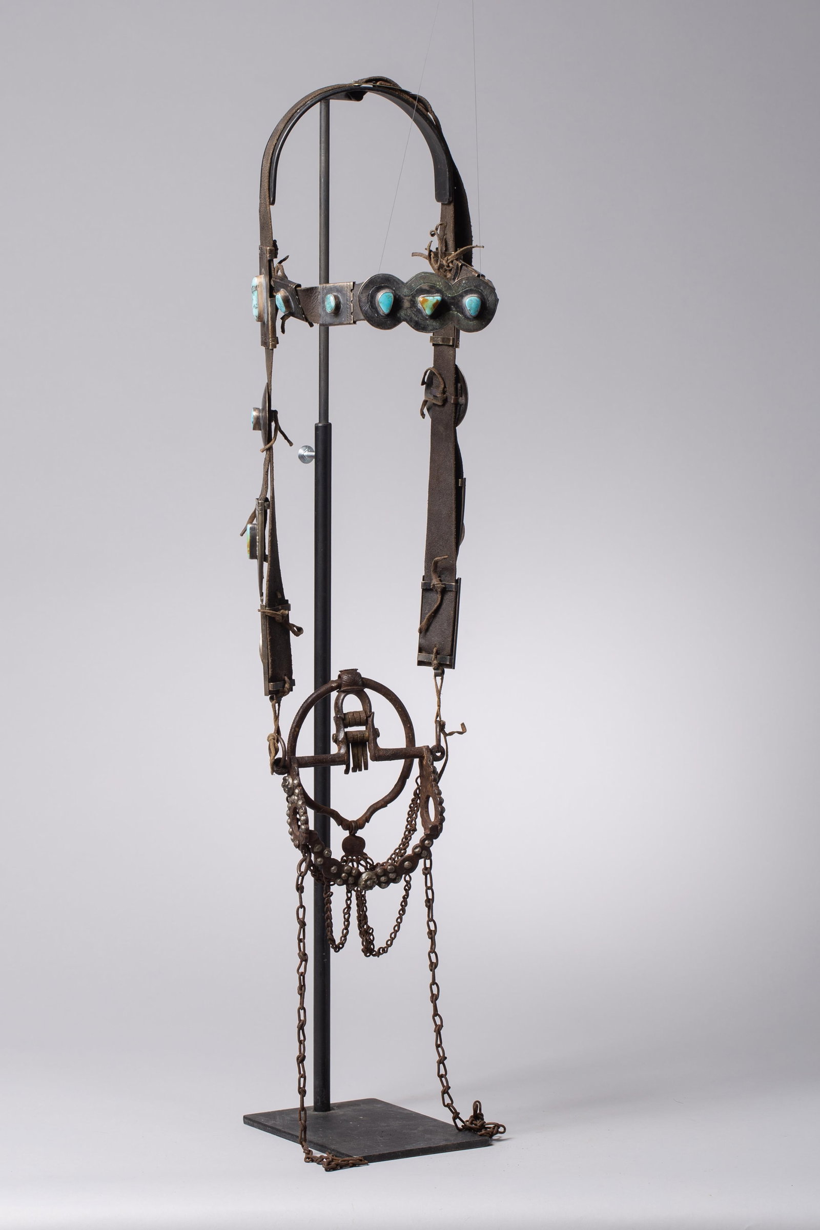 Navajo Bridle with Turquoise: Navajo Silver & Turquoise Headstall with Antique Mielero BitAn exceptional and rare early-to-mid 20th-century Navajo handmade silver and leather headstall, paired with a classic historic iron ring bit