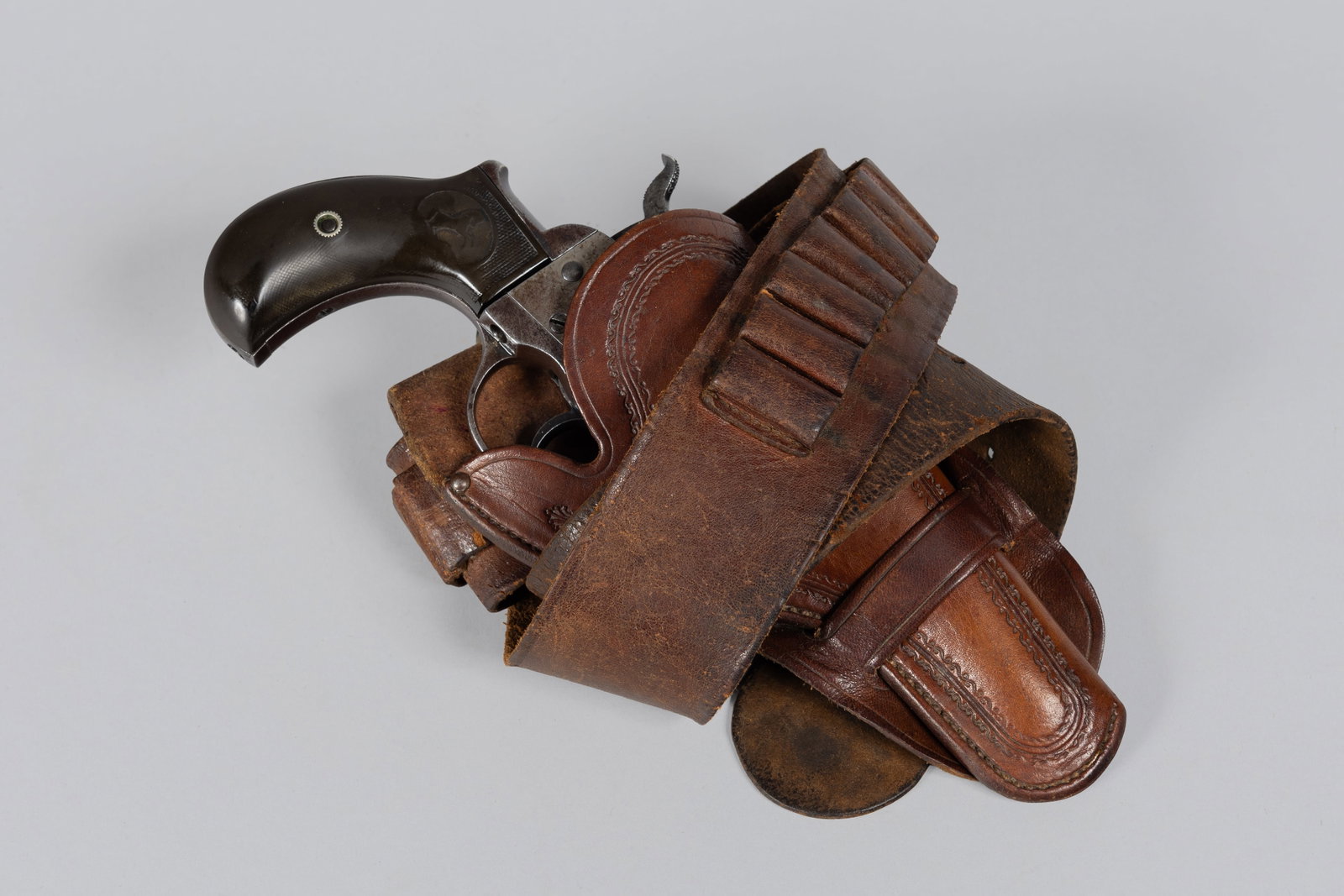 Late Production Colt Model 1877 "Lightning" Double Action with an Unmarked Leather Holster and Gun (1 of 20)