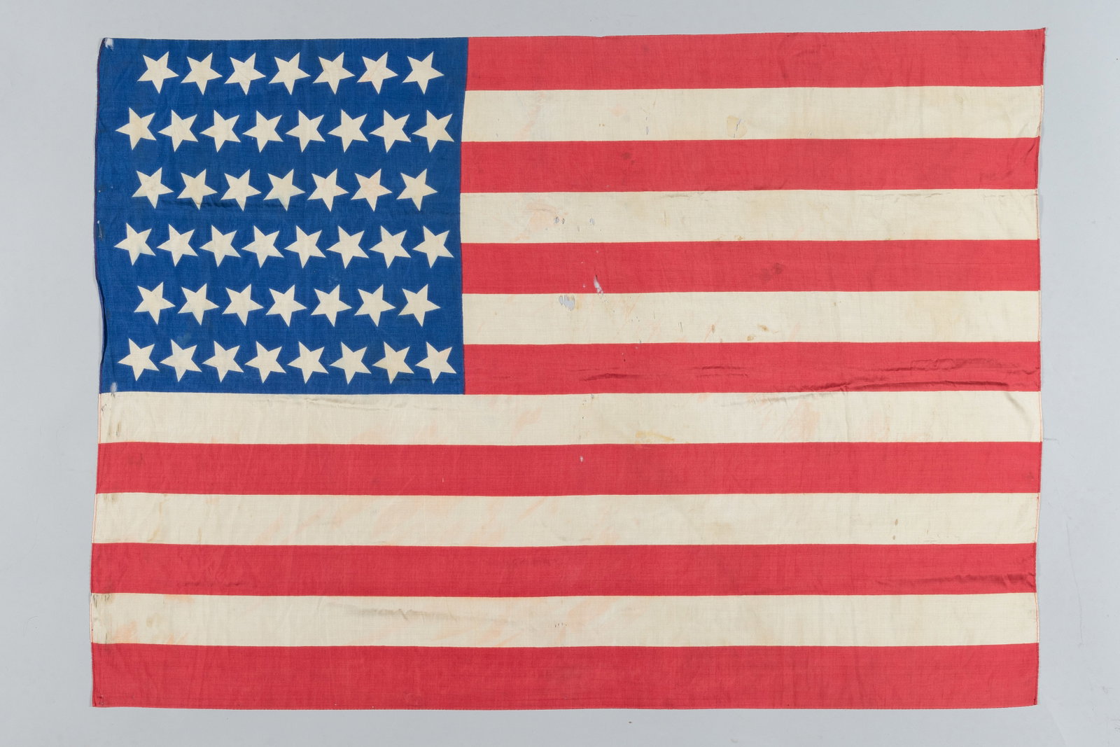 Rare 45-Star American Silk Parade Flag (1896–1908): An authentic piece of turn-of-the-century patriotic Americana celebrating Utah statehood. This official 45-star United States national flag represents a transformative twelve-year period in American h