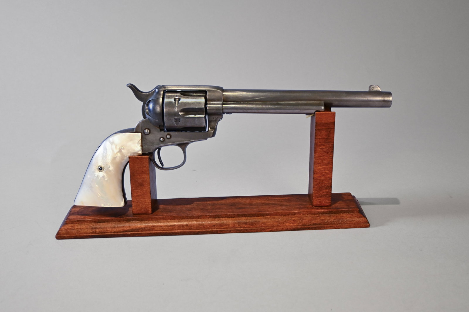 Antique Colt Single Action Army Revolver with Pearl Grips: First Generation Colt Single Action Army "Peacemaker" Revolver, manufactured in 1889. This revolver features Mother-of-Pearl grips, a 7 ½-inch barrel complete with a standard blade front sight 
