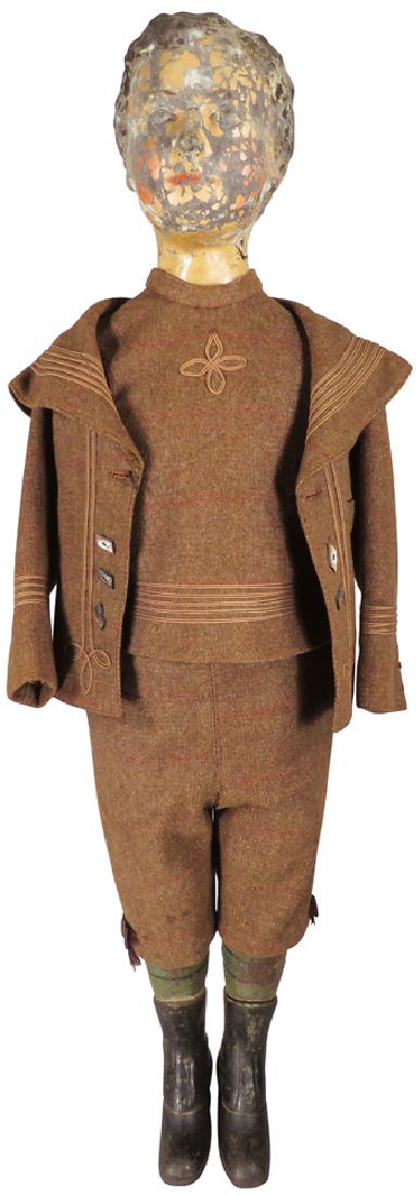 Antique Store Display Mannequin: Antique Store Display Mannequin, ca. late 1800's. Dressed in original wool suit. Cast iron feet, light composite head and body. Paint flaking otherwise good original condition. 39 inches tall.