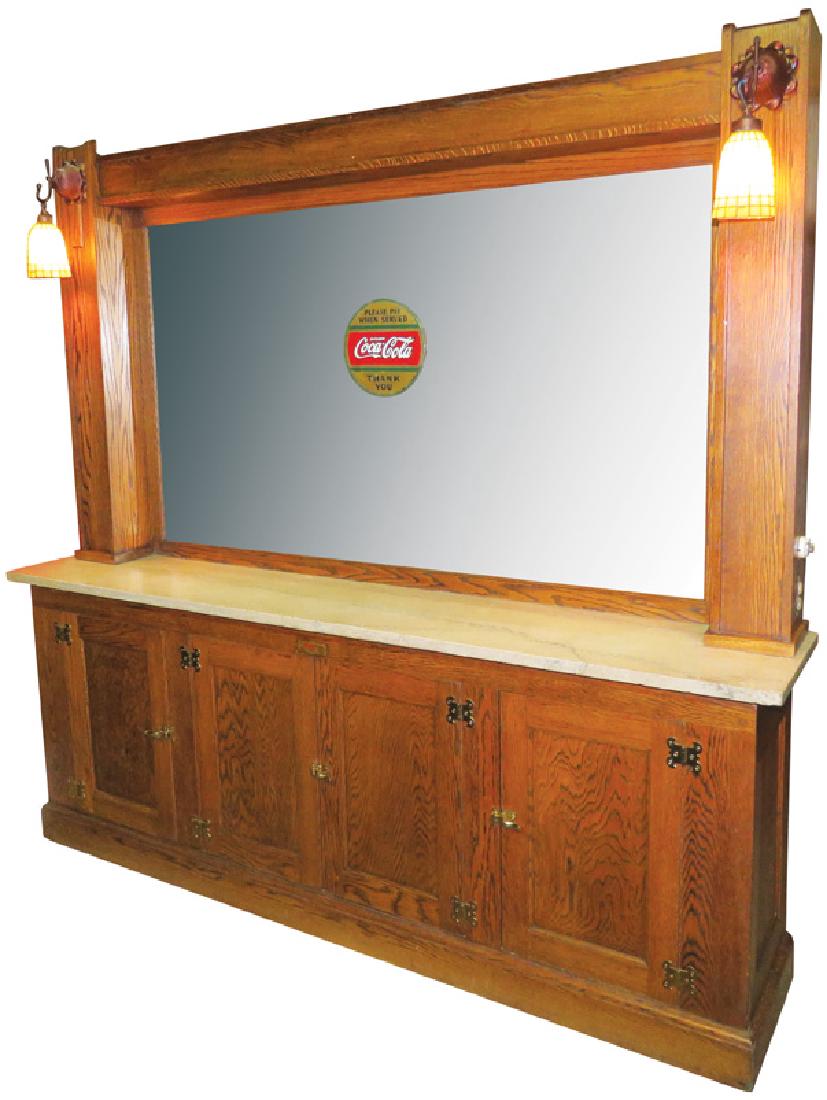 Soda Fountain Back Bar: Soda Fountain Back Bar. Oak with Marble top shelF Matching light fixtures and Original Coca Cola Sign on the Mirror. Mirror has some silver loss otherwise very good condition. 96 X 91 X 18.