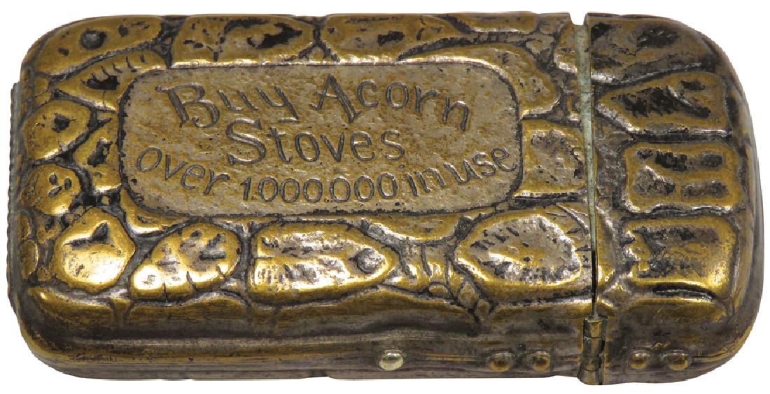 Acorn Stoves and Ranges Match Holder: Acorn Stoves and Ranges Match Holder. Nickel plated brass with stone path motiF 2 5/8 X 1 1/2 inches.