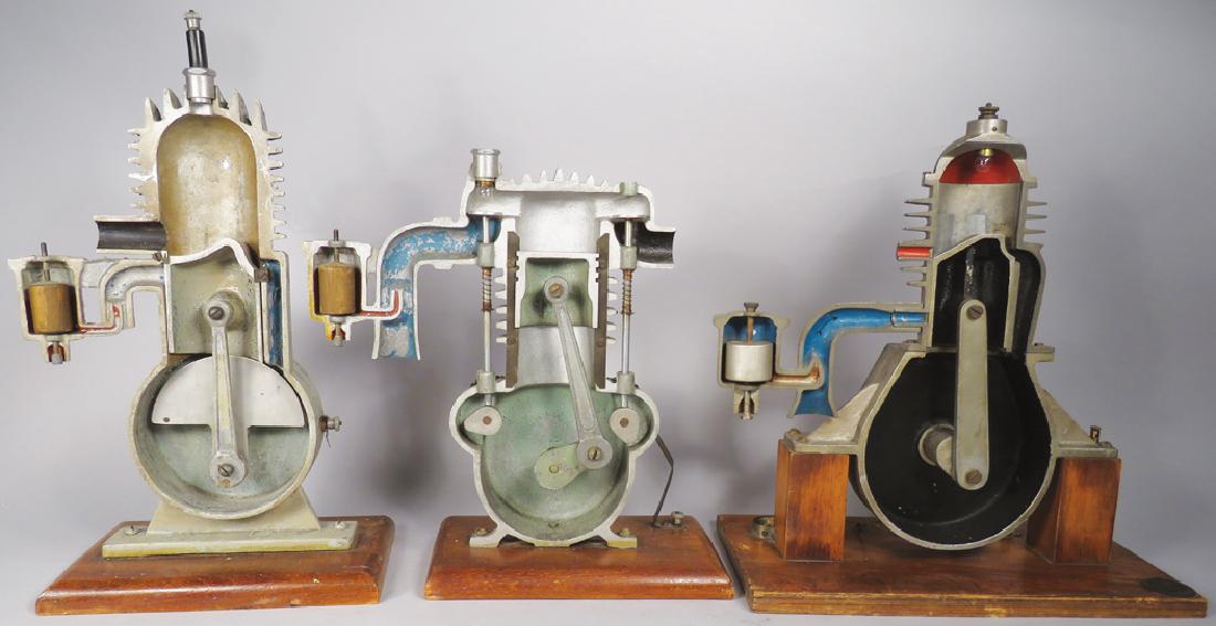 German School Training Models: German School Training Models. 3 models include cut-away motors, 2 two stroke and one four strokE Tallest measures 14 1/4 inches.