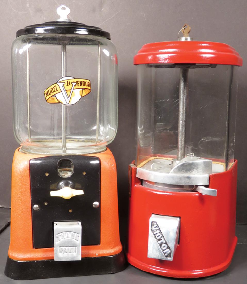 Two Peanut Vendors: Two Peanut Vendors. Red cast aluminum with celluloid crank handlE Victor one cent machine has broken globE Tallest measures 15 inches.